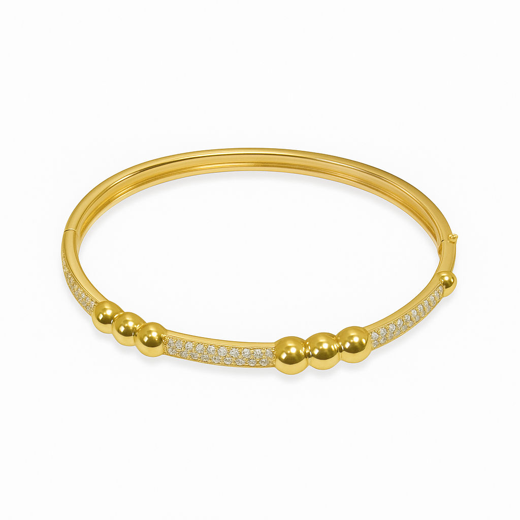 The Skylar Project bangle bracelet featuring three balls and a pave bar design on a sleek metal band.
