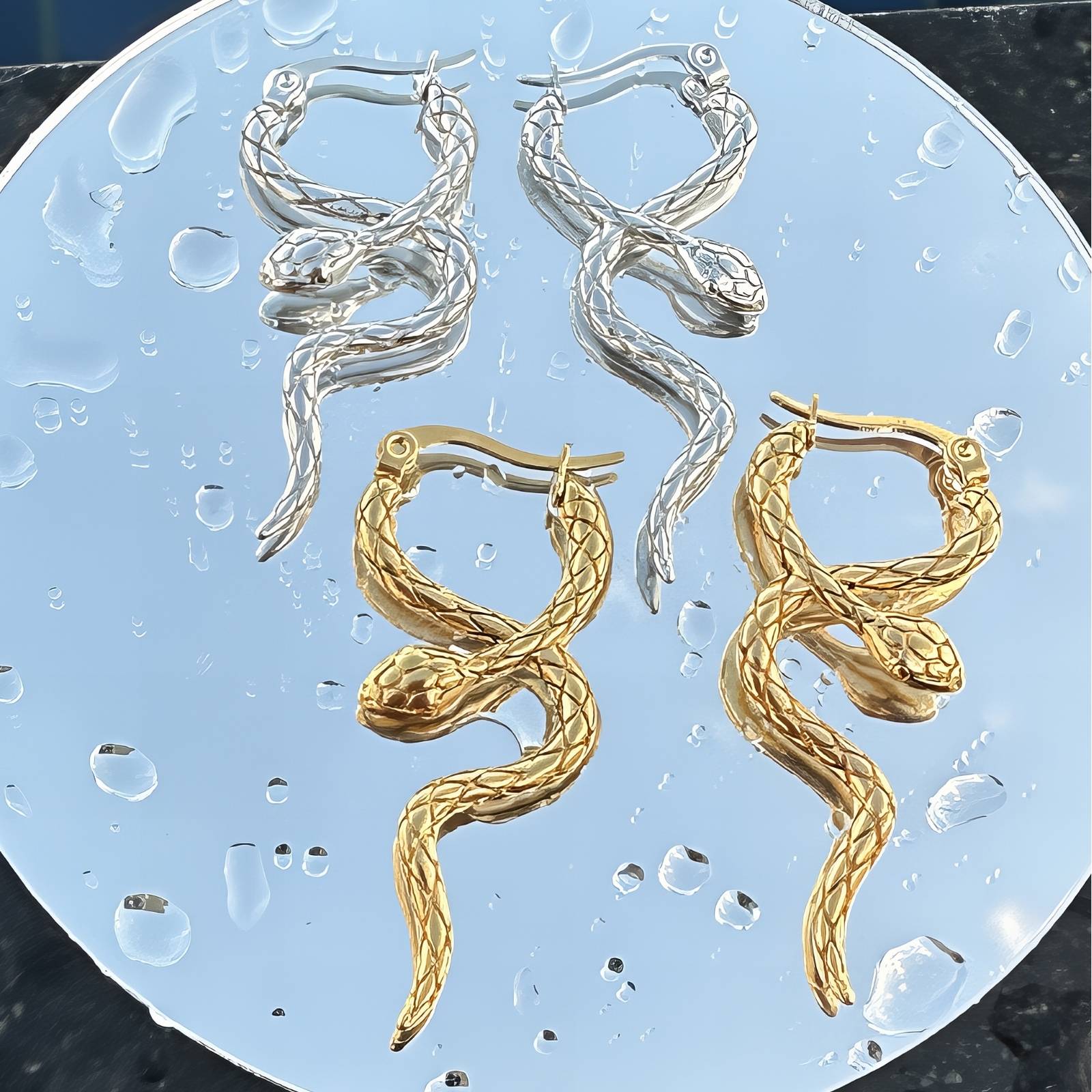 Stainless steel snake earrings with intricate design, showcasing a stylish and modern look for everyday wear.