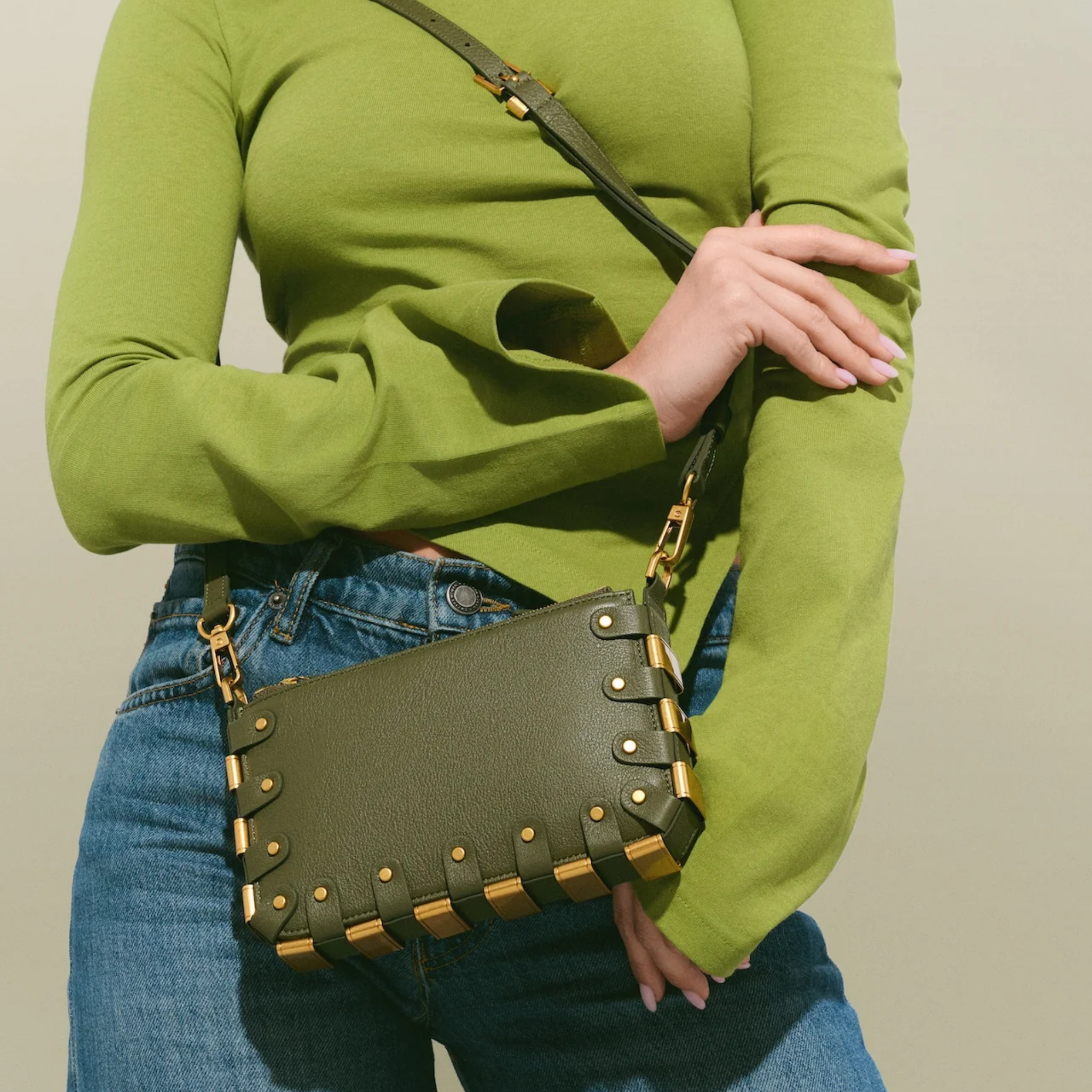 RAPT The Rapture crossbody bag with adjustable strap, black leather exterior, and sleek modern design.