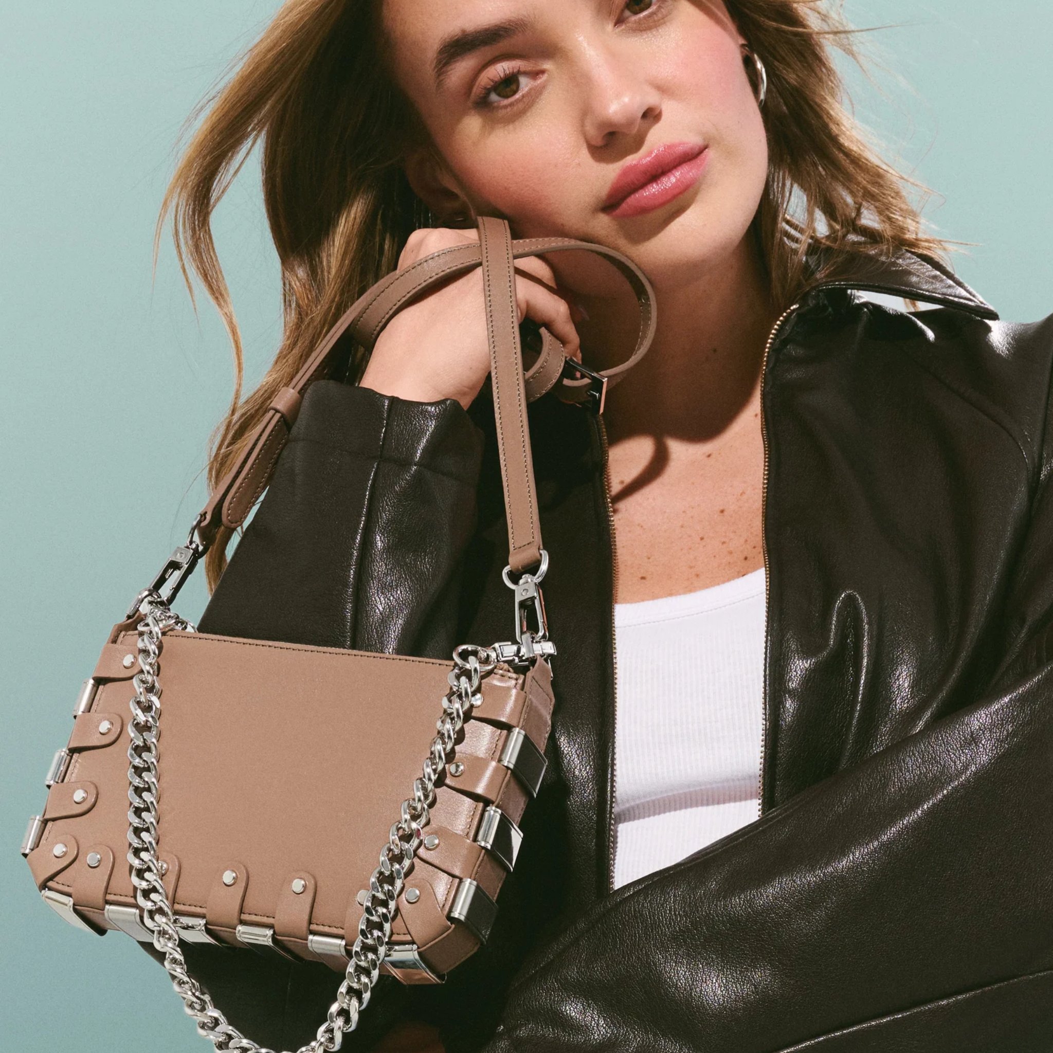 RAPT The Rapture Crossbody Bag featuring a sleek design, adjustable strap, and compact size perfect for everyday use.