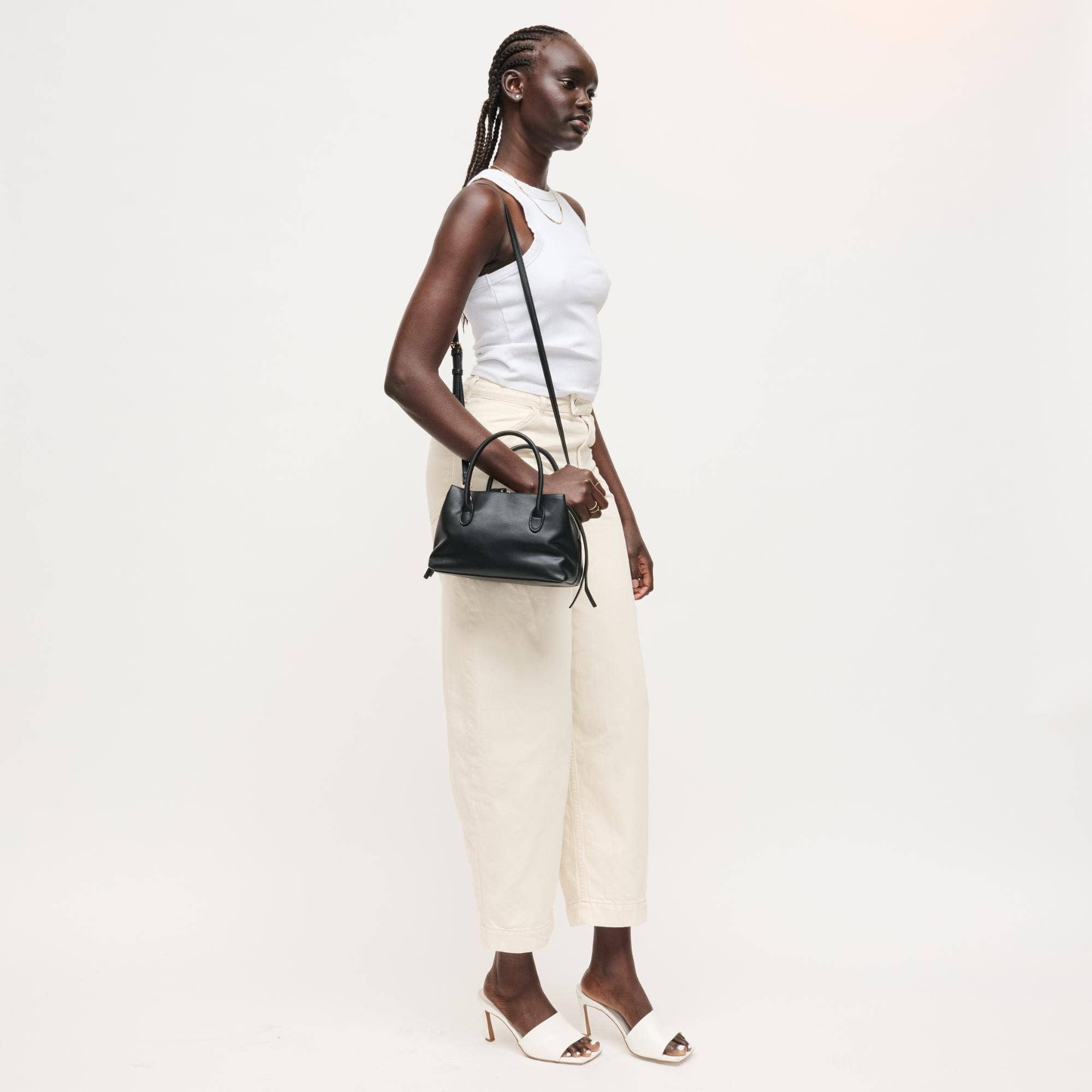 Urban Expressions Logan Crossbody bag featuring a sleek design with adjustable strap and stylish exterior for everyday use.