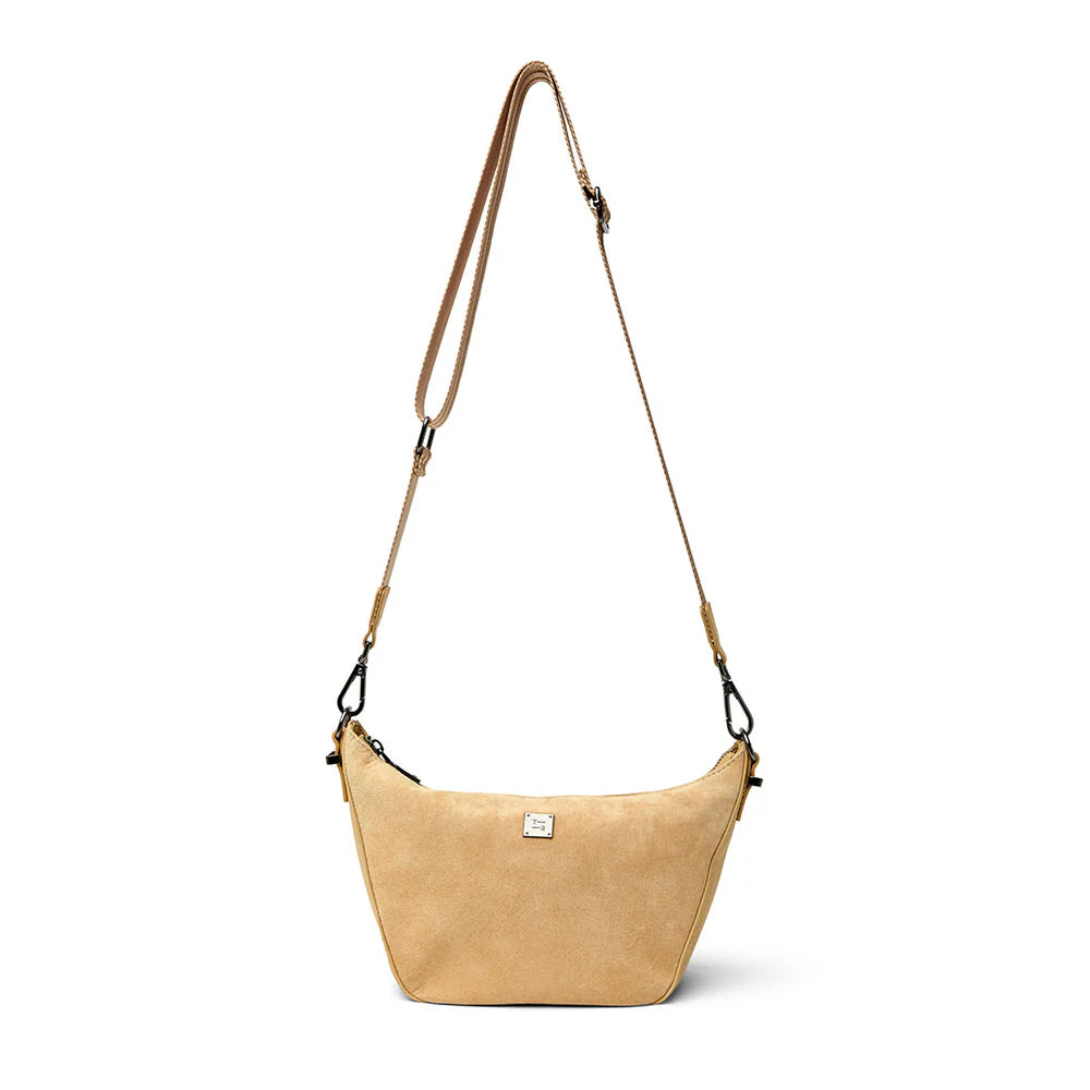 Think Royln Moonbeam bag featuring sleek design and contemporary style, shown in a close-up image highlighting its material and shape.