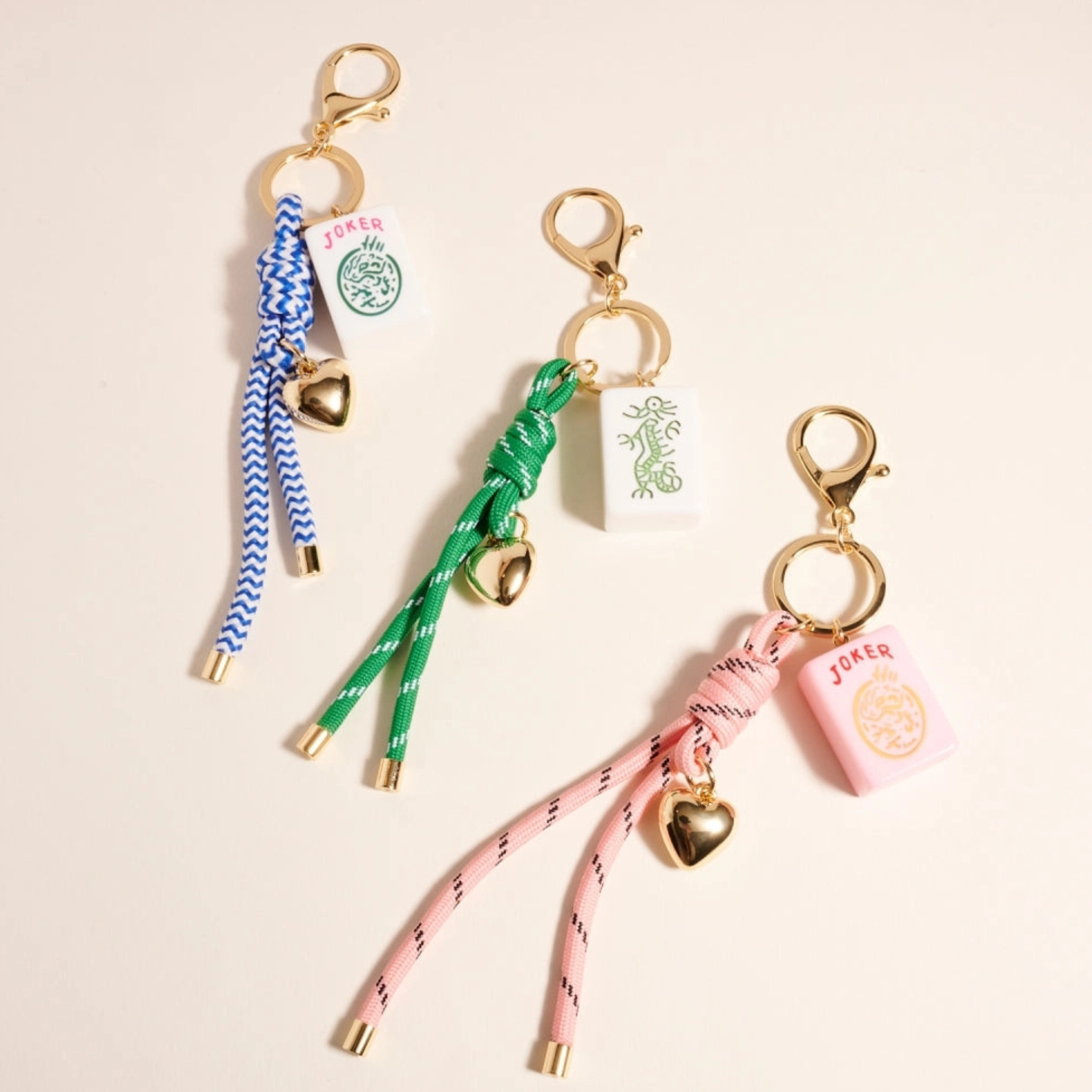 Private label Mahjong Tile Puffy Heart Cord Keychain bag charm with colorful heart design and attached keyring.