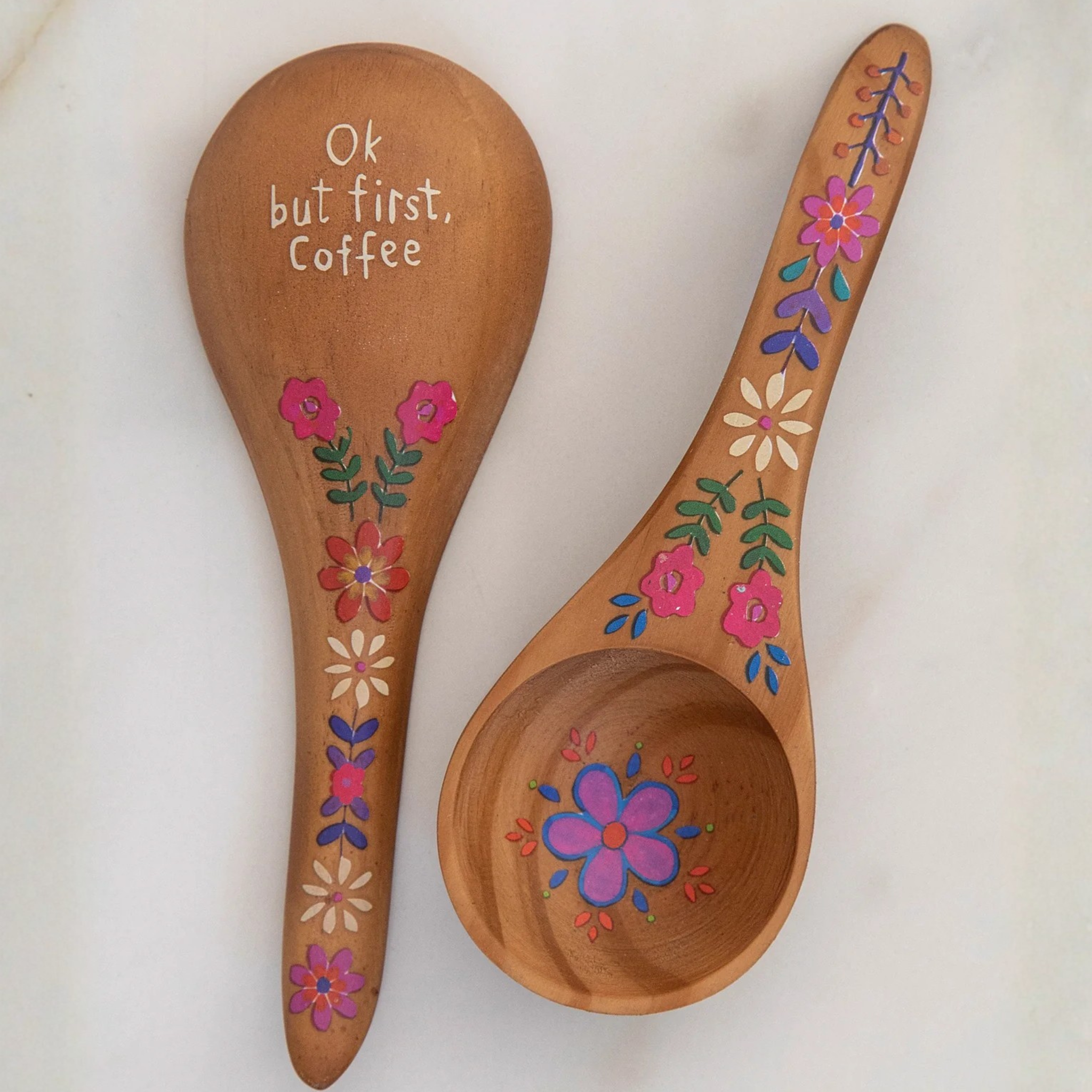 Wooden coffee scoop by Natural Life with engraved "But First Coffee" design, ideal for measuring coffee grounds.