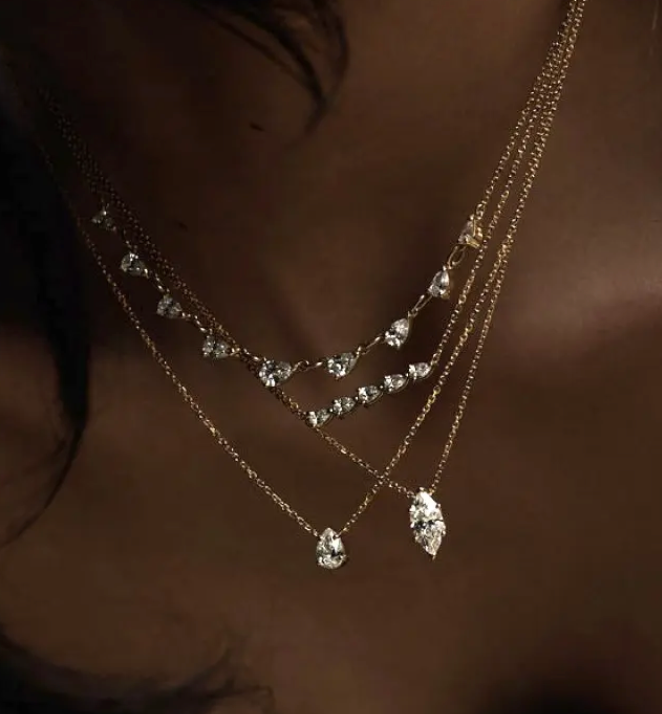 14K gold layering necklace from the Solitaire Collection featuring a sleek steel design by Private label.