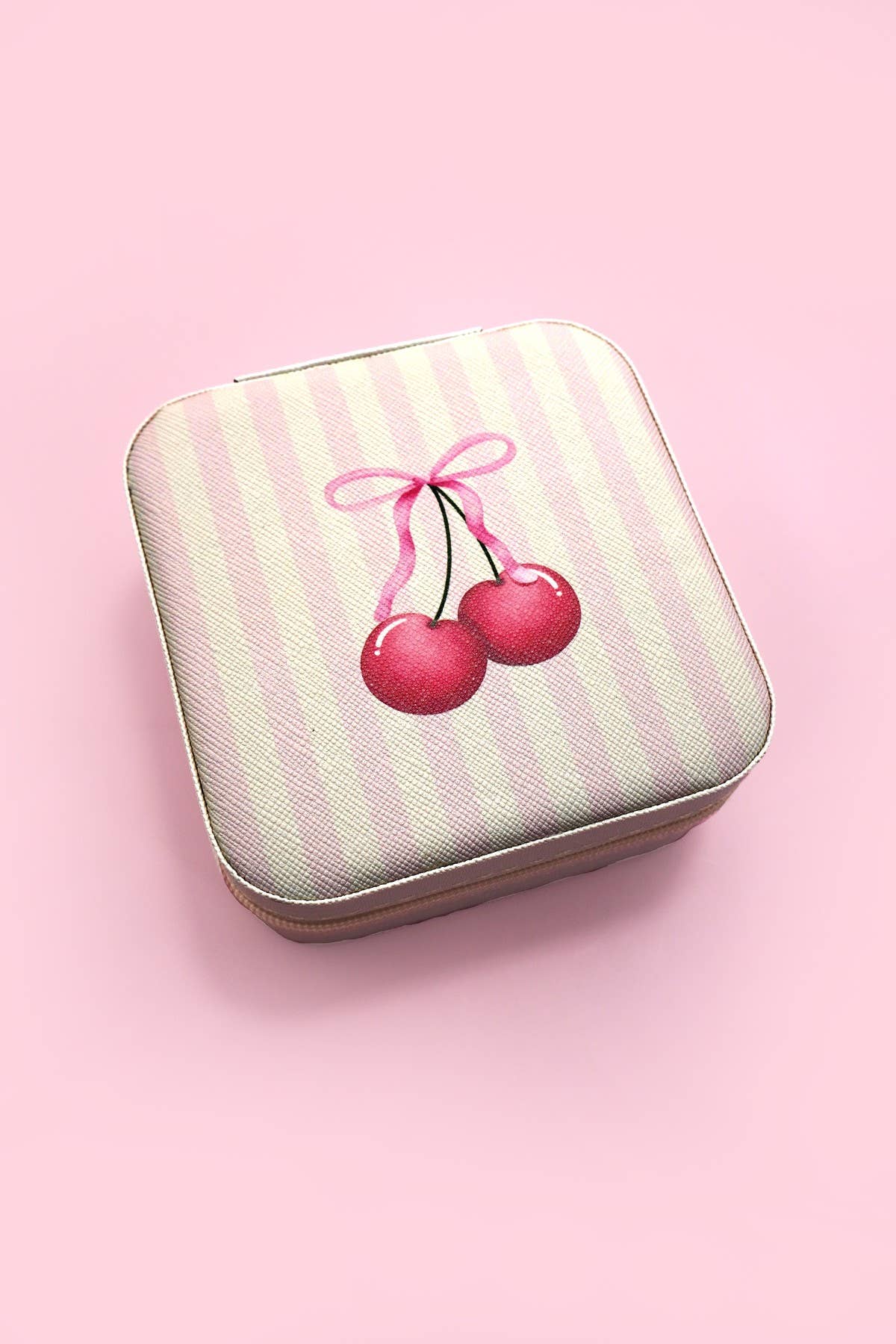 Private label Coquette jewelry organizer travel pouch with compartments for jewelry storage and secure closure.