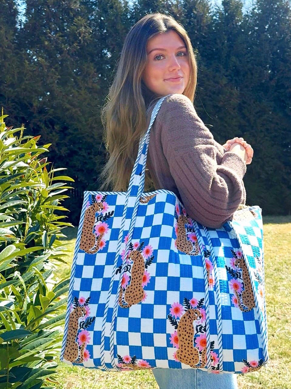 Large Folklore Couture quilted tote bag with jaguar print, spacious shopping tote with padded handles and stylish design.