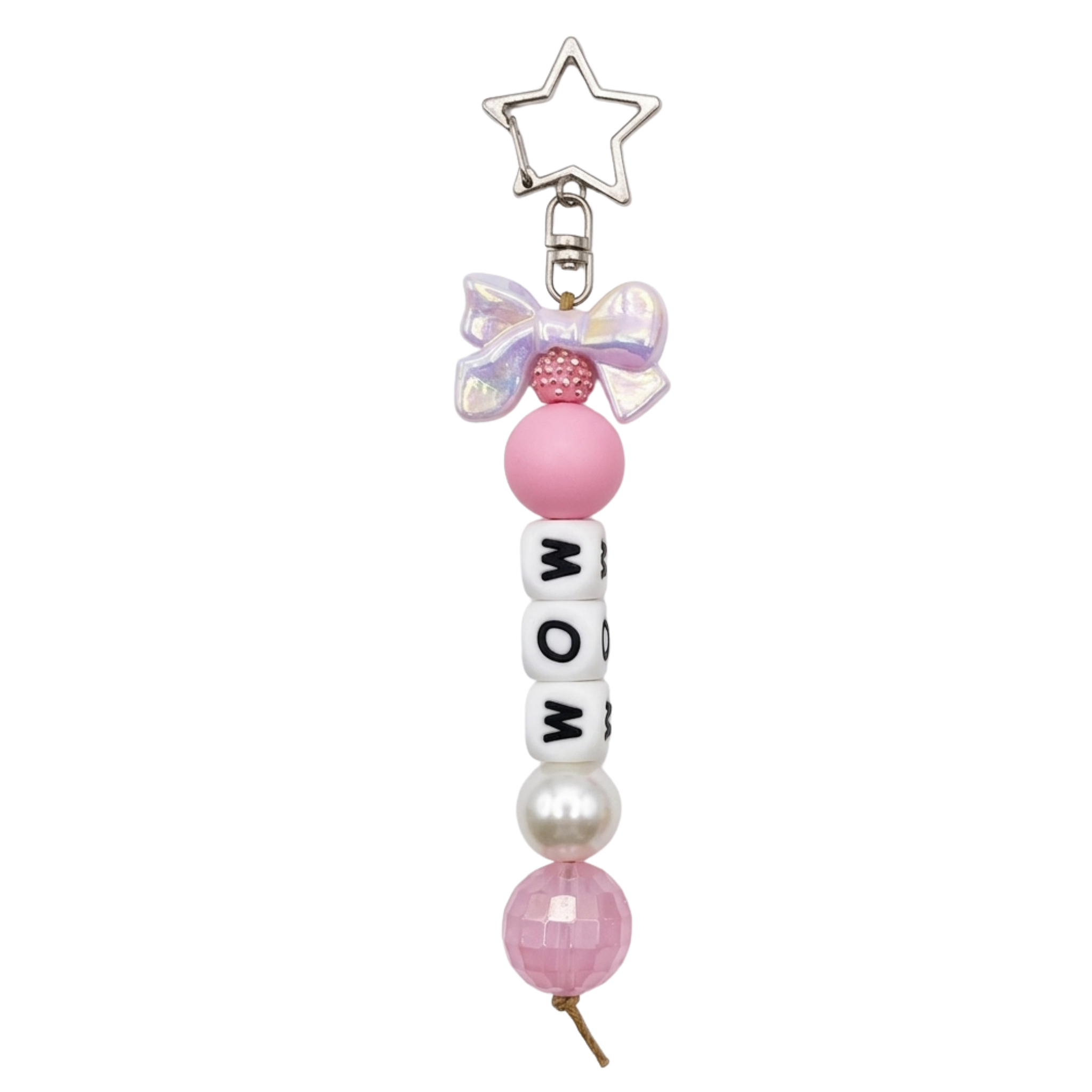 Jules by the Sea bag charms and keychains featuring colorful seashell and starfish designs on a white background.