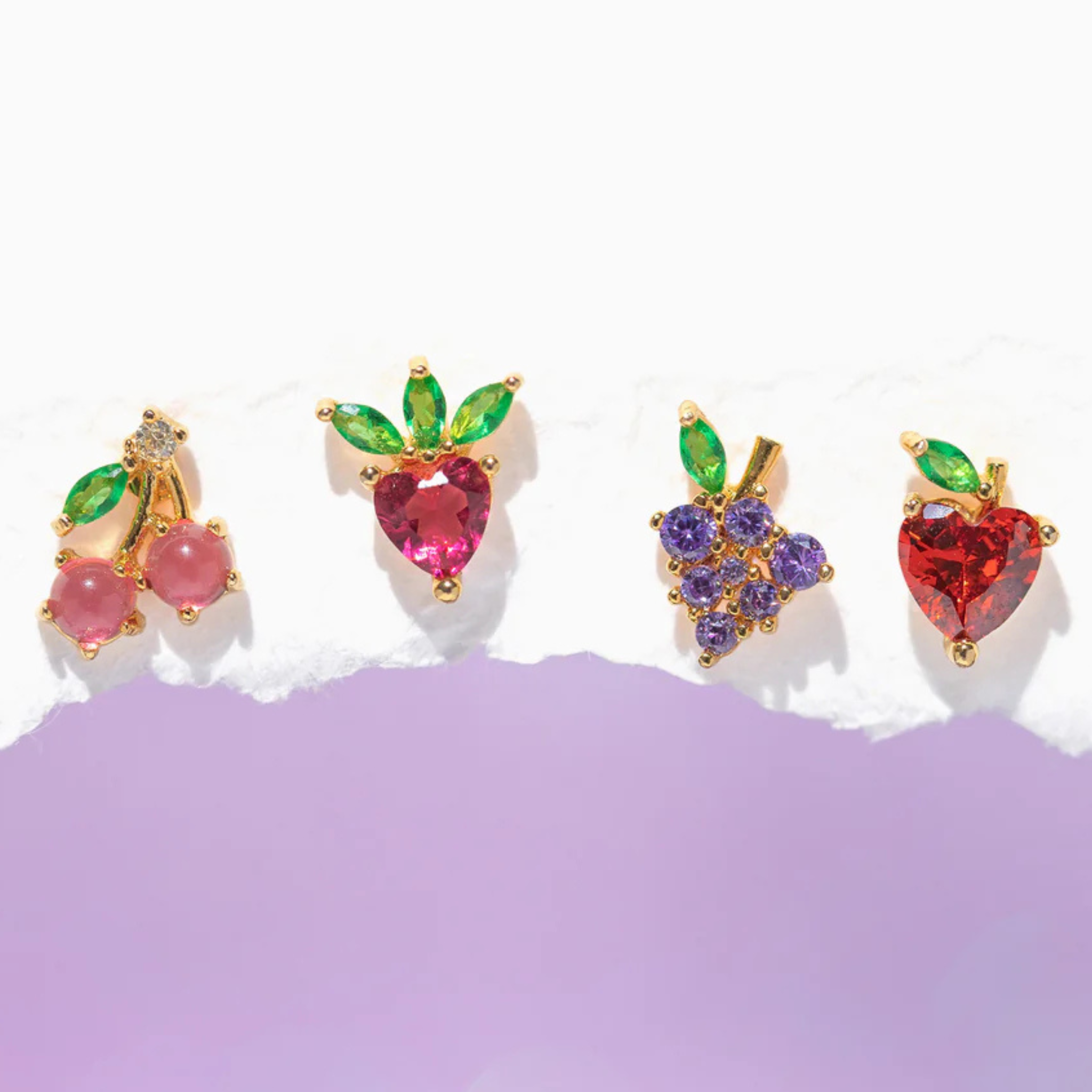 Girls Crew fruit basket stud earrings featuring colorful fruit designs on a gold-tone setting.