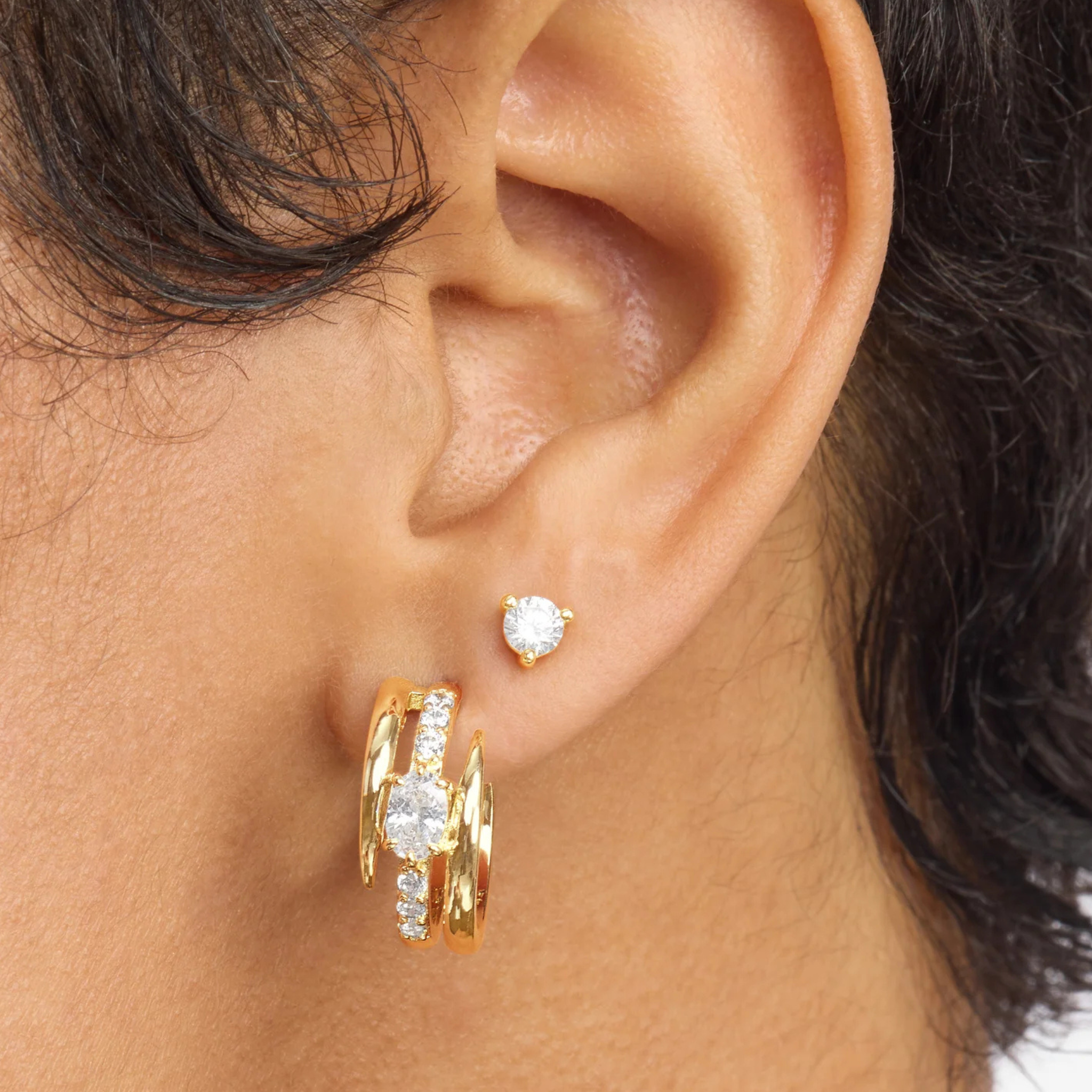 Melinda Maria She's on Point Pavé Lasso Huggies earrings with sparkling pavé stones and a stylish lasso design.