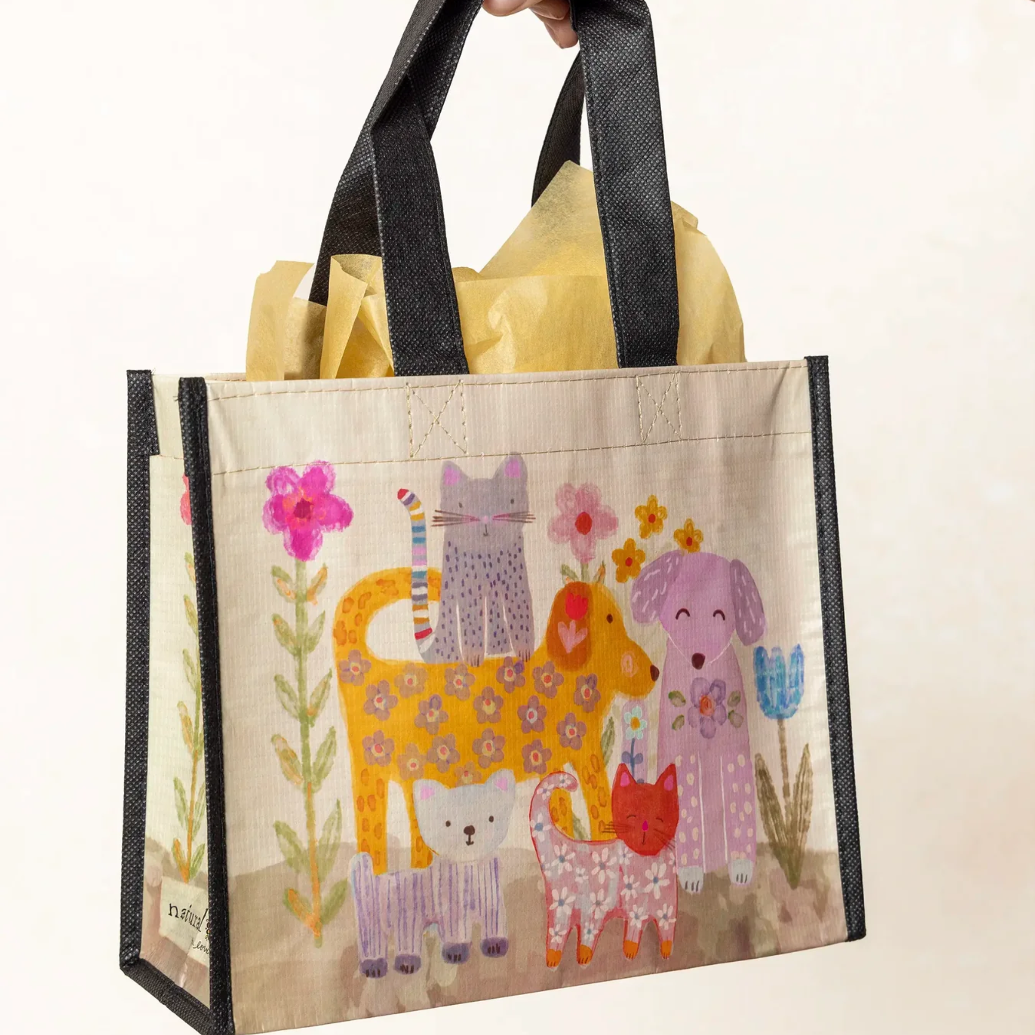 Set of three Natural Life medium tote bags with colorful happy designs, perfect for casual outings and everyday use.