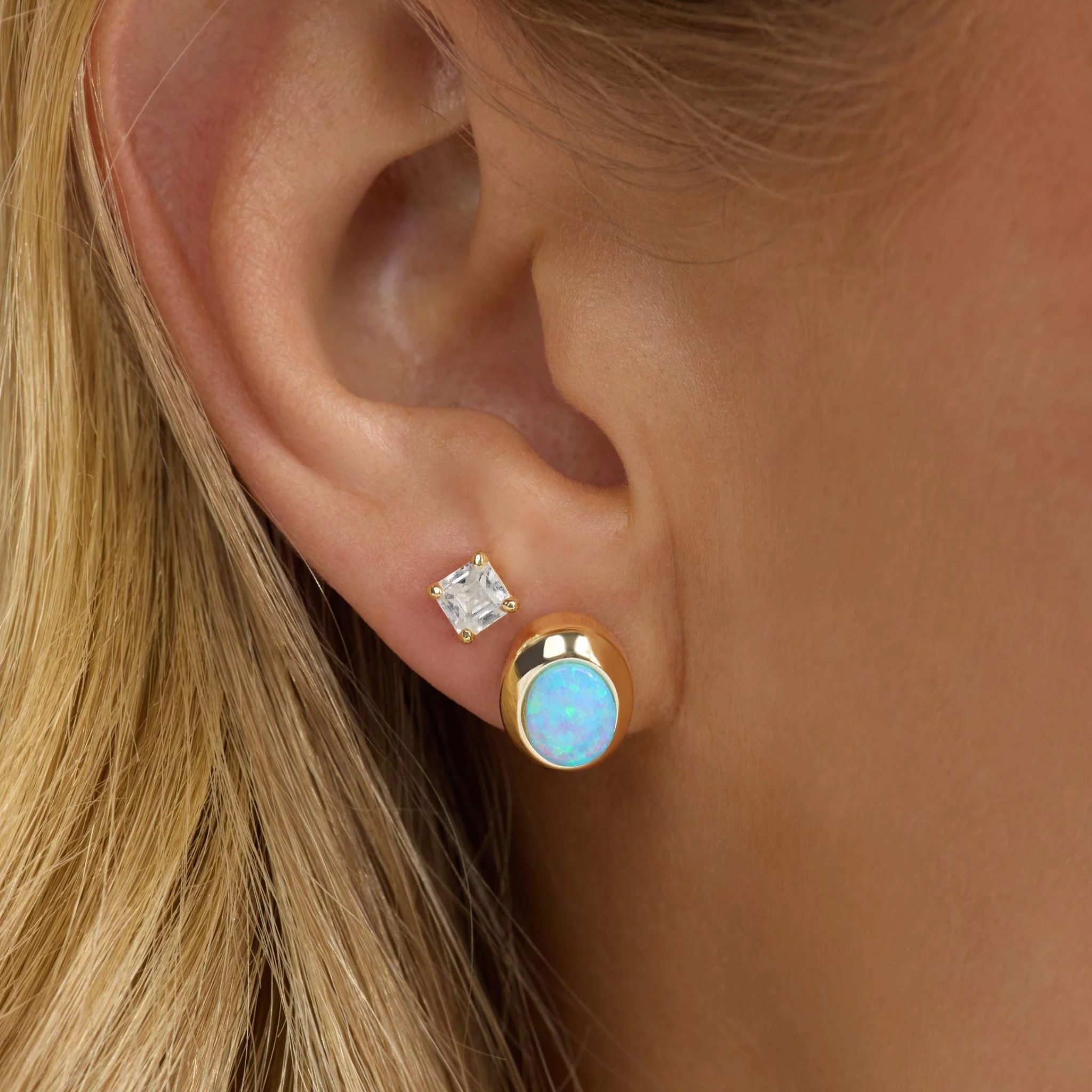 Melinda Maria She's A Boss Studs earrings featuring small, chic gold-tone studs with a bold statement design.
