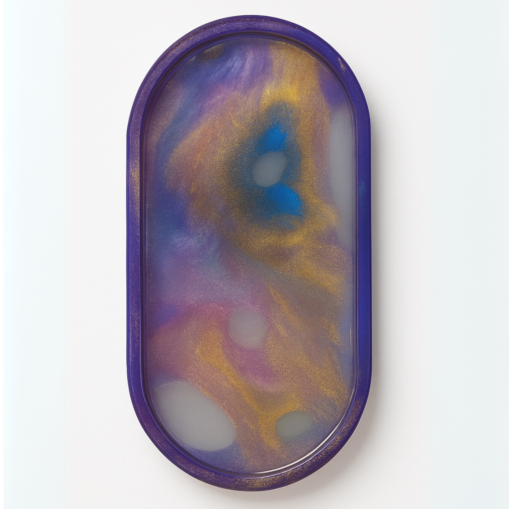 Two swirl and glitter ceramic resin trays with colorful, decorative designs, ideal for jewelry or small items.