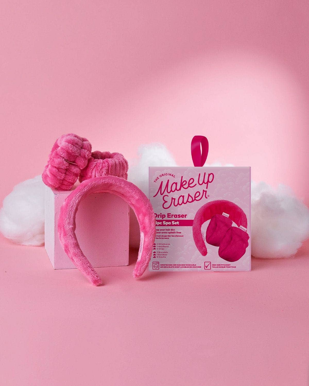 Pink drip headband from The Original Makeup Eraser, part of the Original Pink Drip Eraser Spa Set, featuring soft fabric and stylish design.