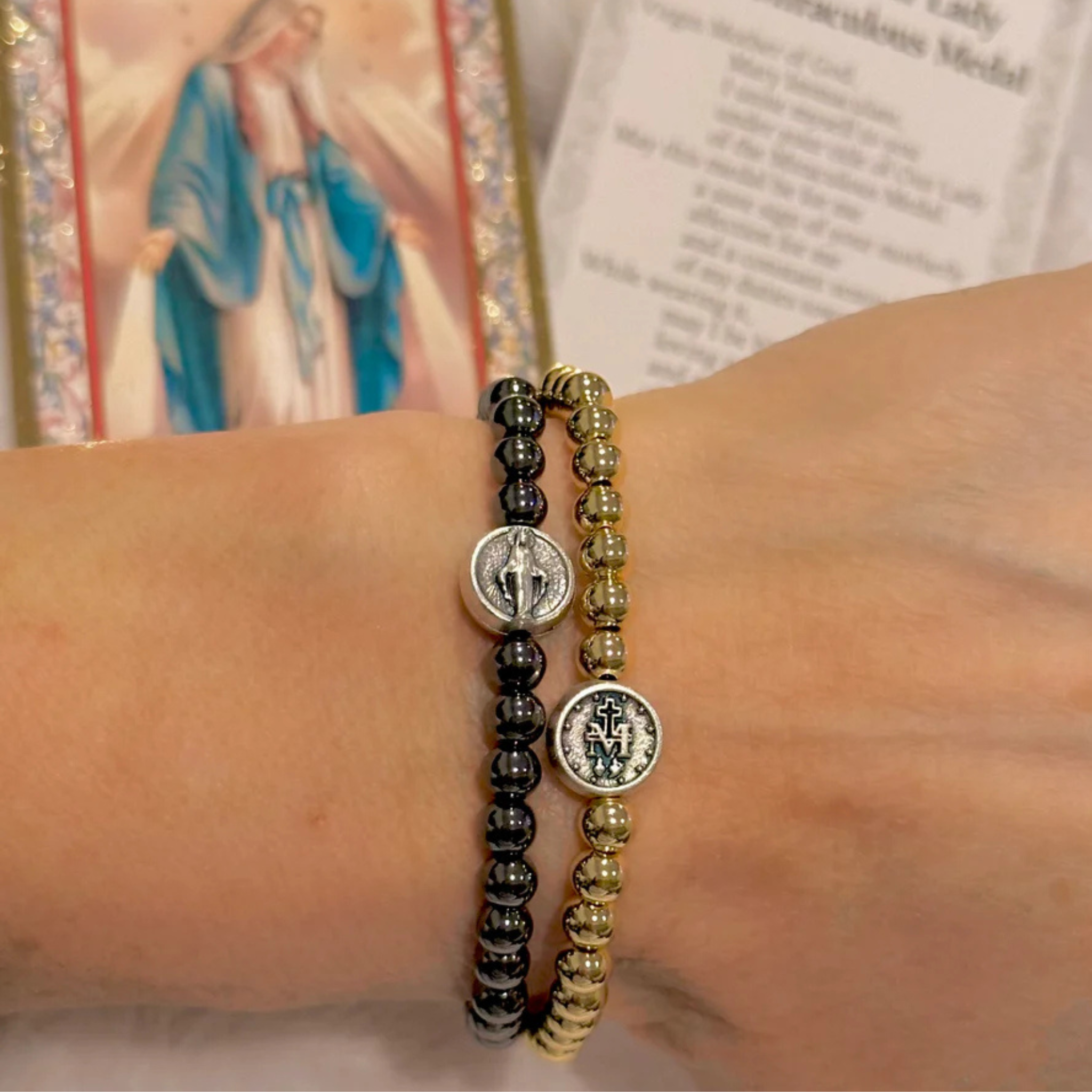 Love Lisa Subliminal Blessed Mother Miraculous beaded bracelet with religious charms and intricate beading detail.