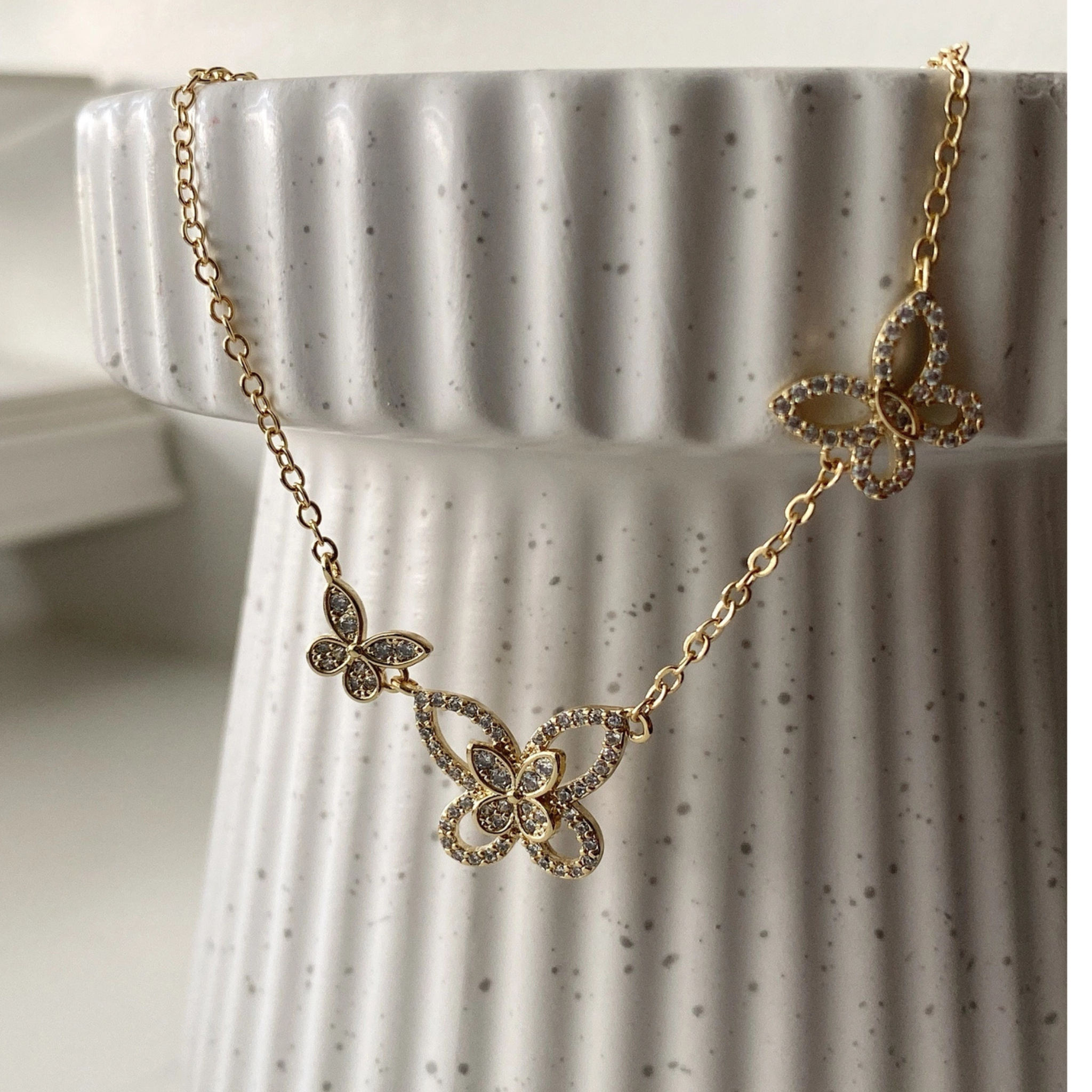Private label Butterfly Dance Necklace featuring a delicate butterfly pendant on a silver chain.