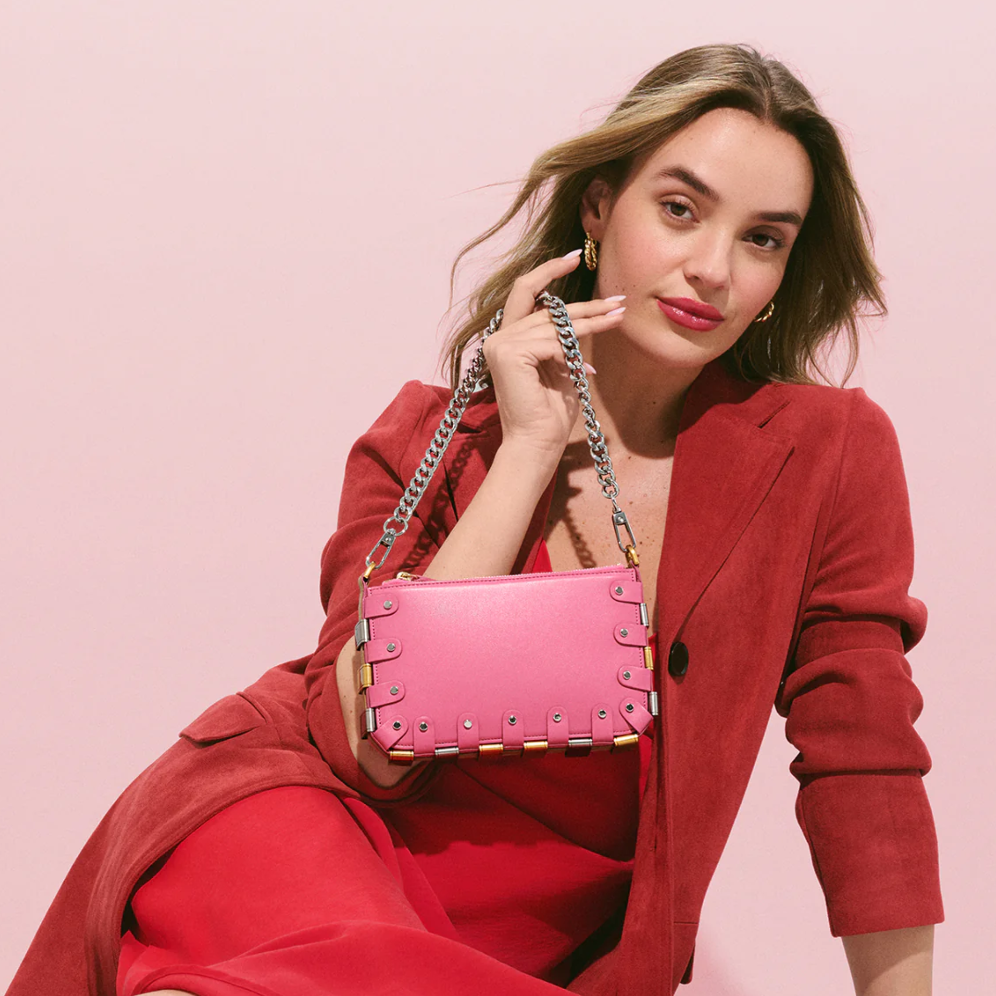 RAPT The Rapture Crossbody Bag in black with adjustable strap and minimalist design, featuring the brand logo on the front.