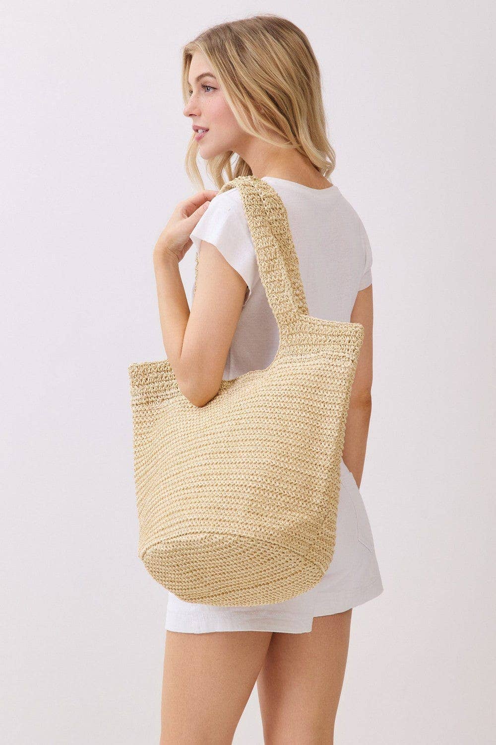 Shannon Handmade Straw Tote Bag from Private Label with woven straw design and sturdy handles, perfect for casual outings.