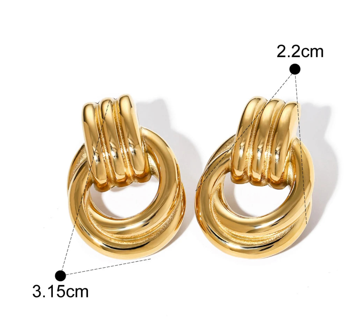 Double knotted two-tone earrings featuring a unique door knocker design by Private Label.