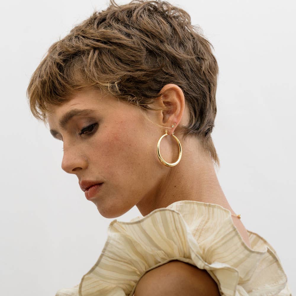 Large Maria Hoops earrings by Amano Studio, featuring bold, circular gold hoops with a polished finish.