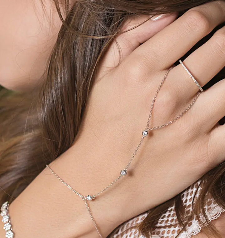 HoopLa 3-Hand Chain Steel featuring a ring and crystal chain bracelet, showcasing intricate design and elegant shine.
