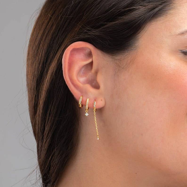 HoopLa huggie drop hoop earrings with chain, silver-tone jewelry featuring small hoop design and delicate chain detail.