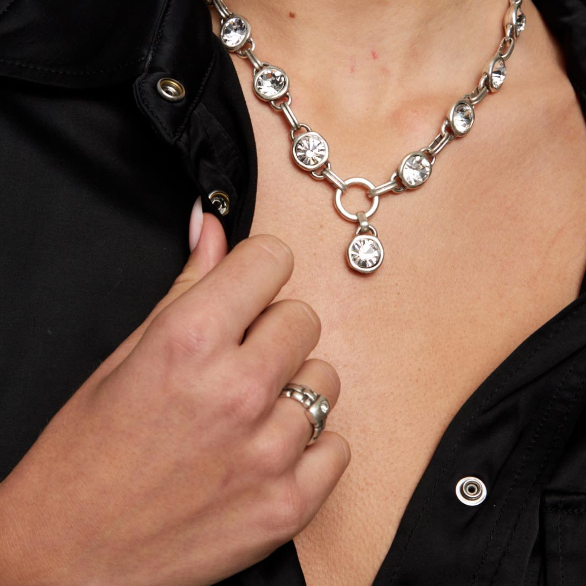 Chanour Aura Eyes Crystal Pewter Necklace featuring a detailed pendant with shimmering crystal accents and intricate pewter design.