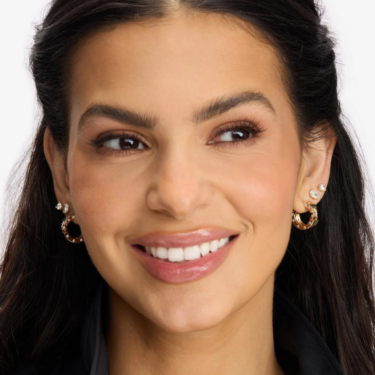 Melinda Maria Ashley Lock Huggies earrings in gold with white diamondettes, featuring a secure locking design and sparkling accents.