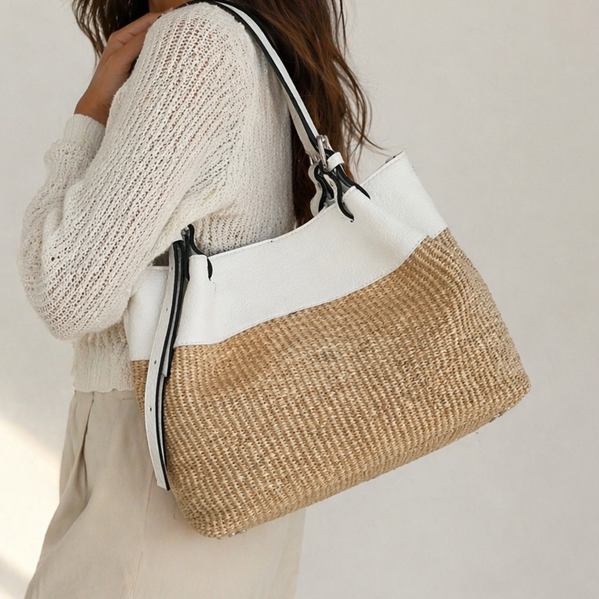 Private label Coastal It Girl Tote handbag with woven texture, featuring tan leather handles and a spacious interior.