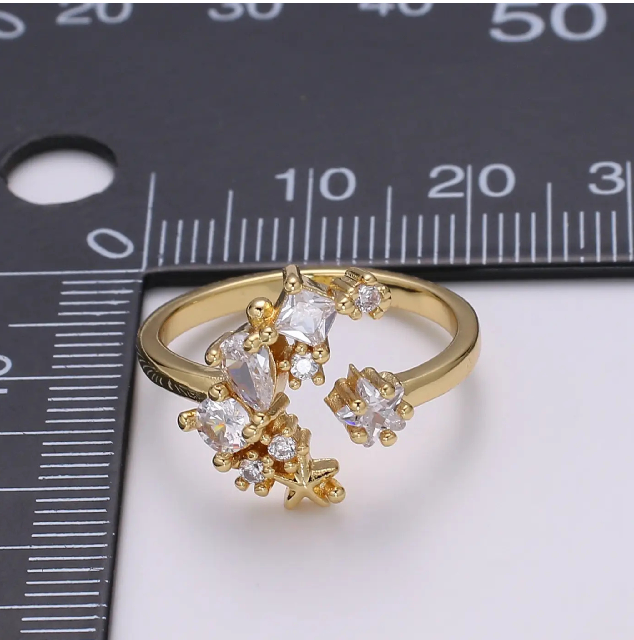 Silver adjustable moon ring with detailed lunar design, perfect for celestial jewelry lovers.