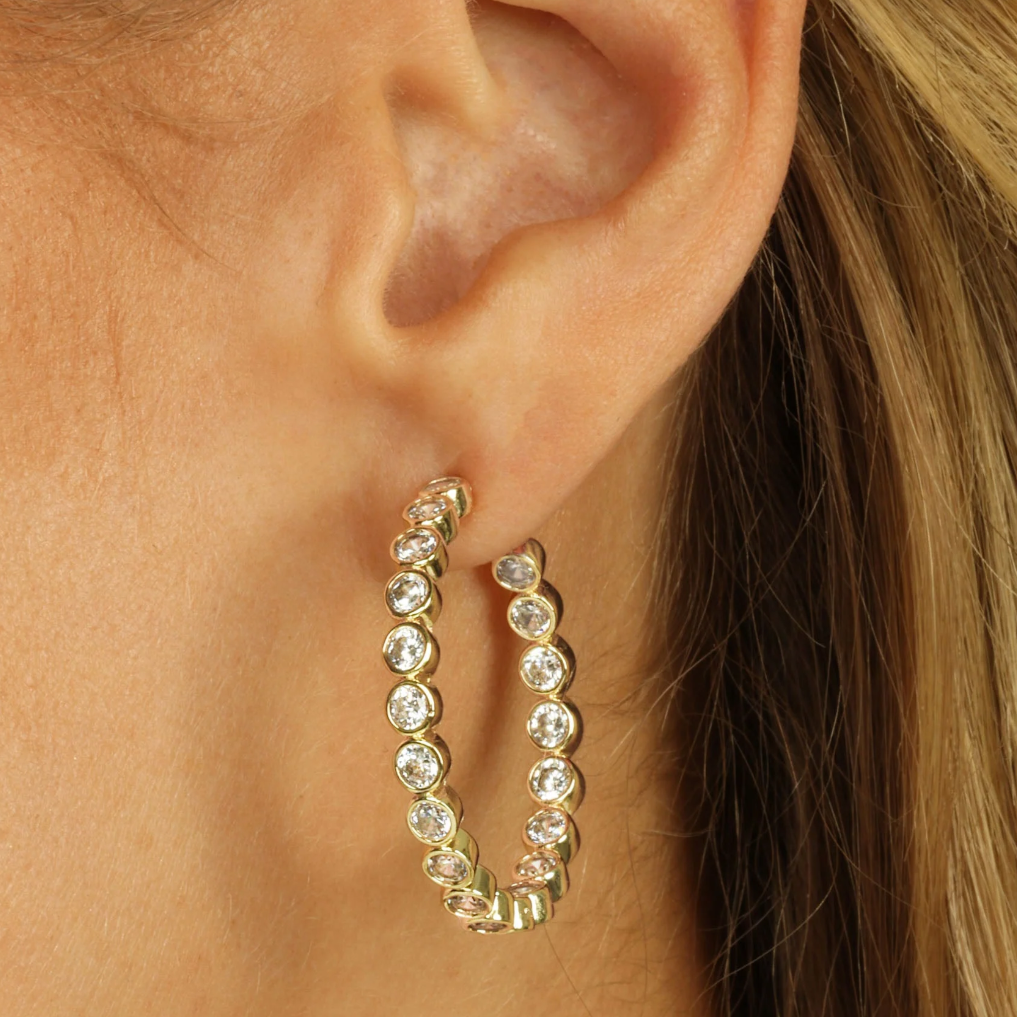 Melinda Maria Baroness Hoops 1.25-inch gold earrings with white diamondette accents, stylish and elegant jewelry accessory.