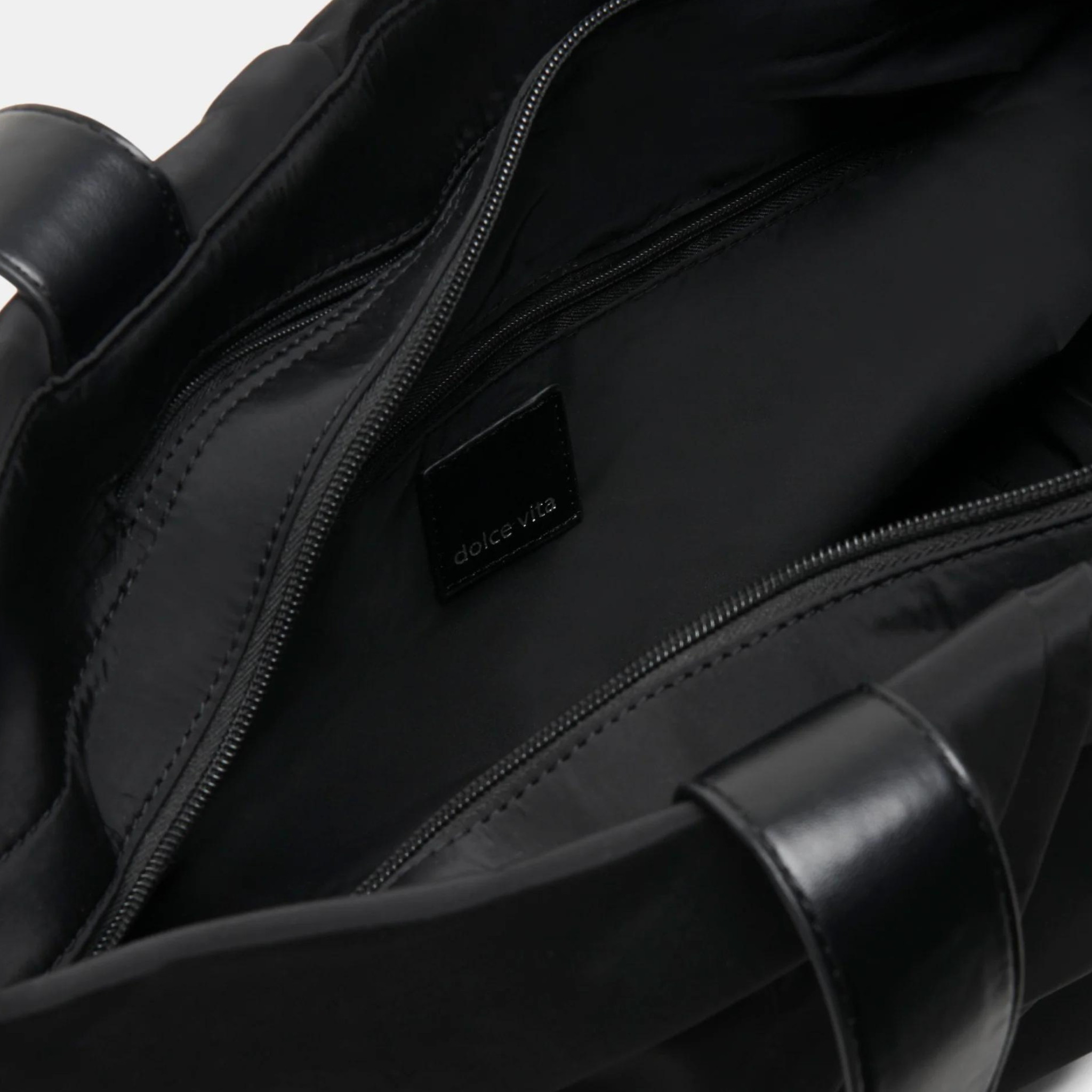 Dolce Vita Tammy Tote in a stylish design, showcasing its spacious interior and sturdy handles.