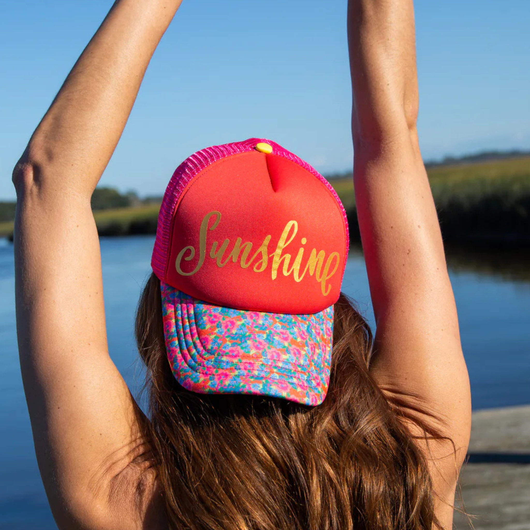 Adjustable Natural Life trucker hat in sunshine yellow with a breathable mesh back and curved bill.