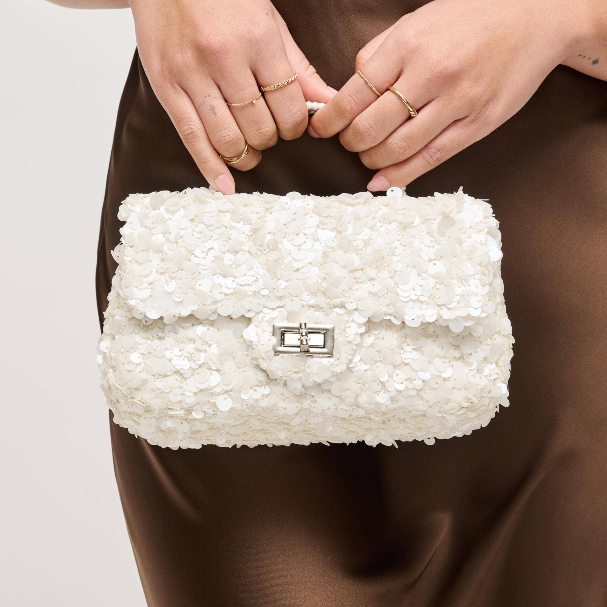 Urban Expressions Ella evening bag with sleek design, gold chain strap, and elegant exterior, perfect for formal events and nights out.
