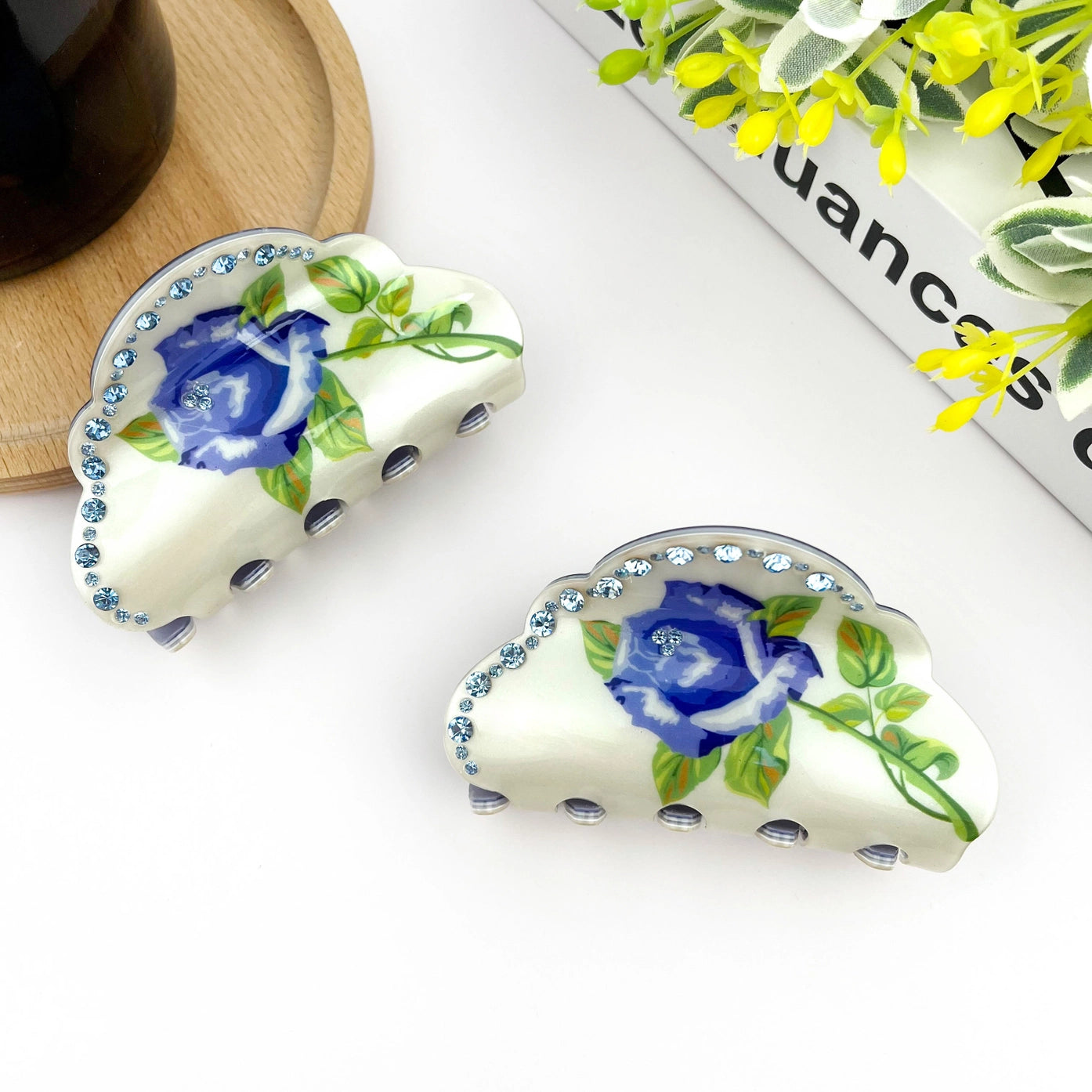 Elegant blue rose claw clip with rhinestones, featuring a half-round design for stylish hair styling.