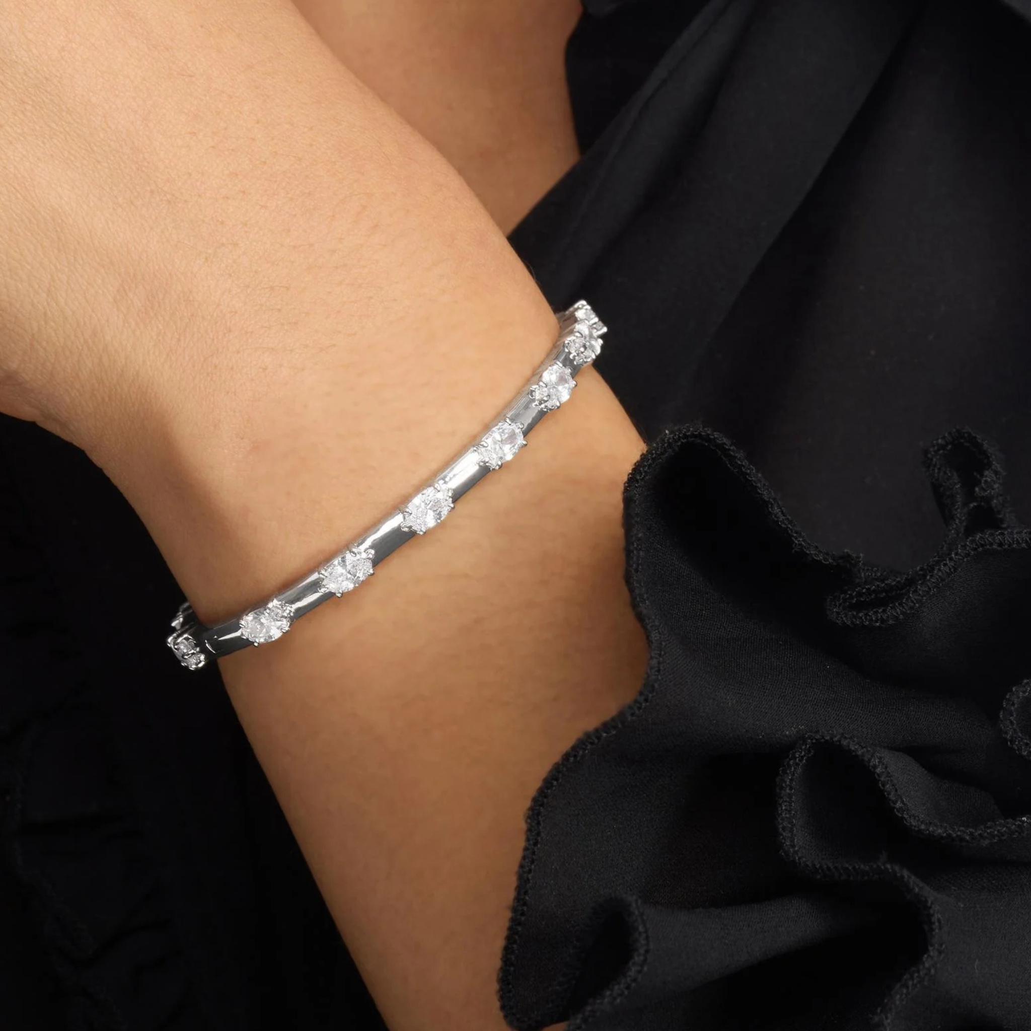 Melinda Maria She's On Point Station Cuff bracelet with sleek metal design and modern style, visible in close-up image.