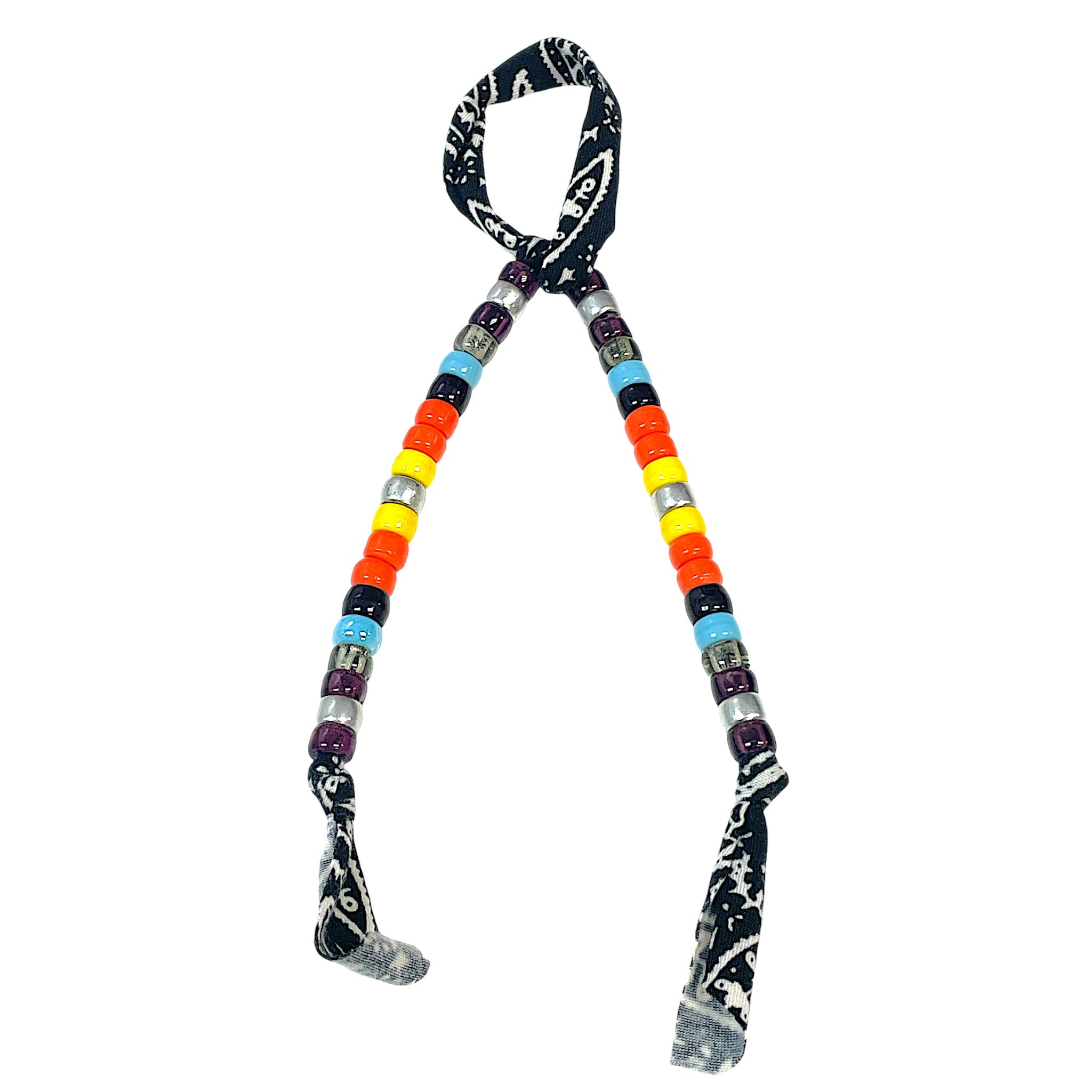 Beadstein x Lets Bag It beaded bag charms attached to a handbag, featuring colorful beads and decorative charms.