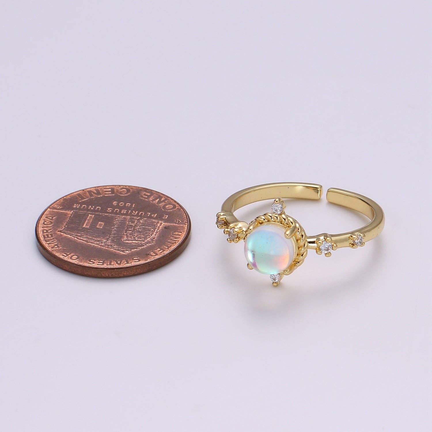 Dainty adjustable ring featuring a celestial moonstone design by a private label brand.