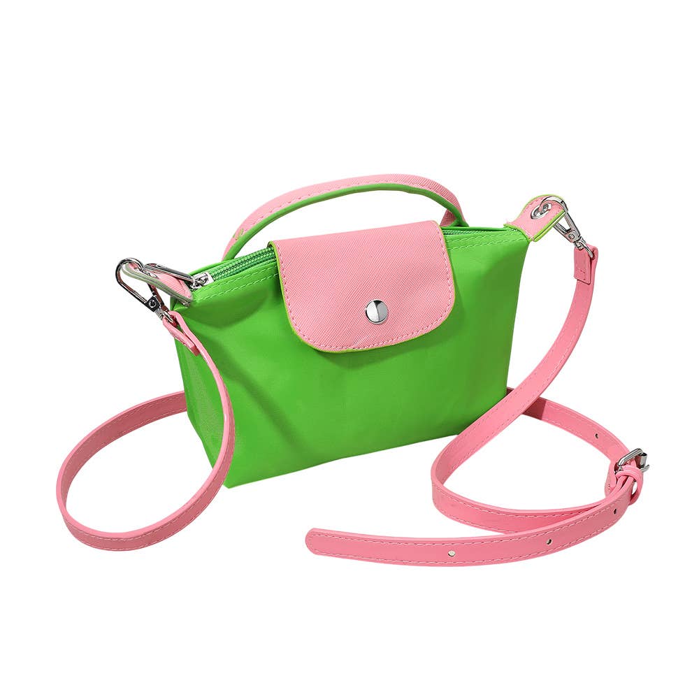 Private label compact two-tone handbag with crossbody strap, featuring stylish design and versatile accessory for everyday use.