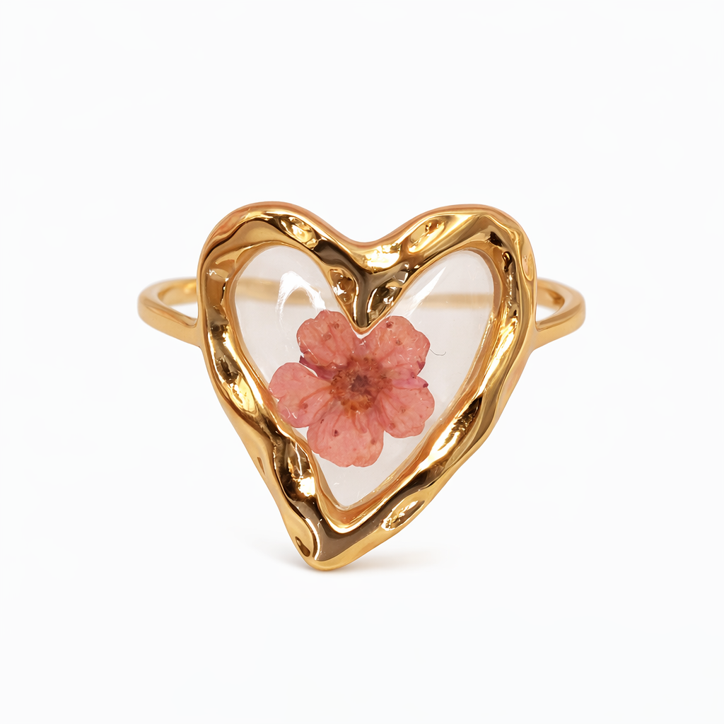 Private label pressed floral ring featuring intricate floral designs on a sleek band, perfect for elegant jewelry collection.