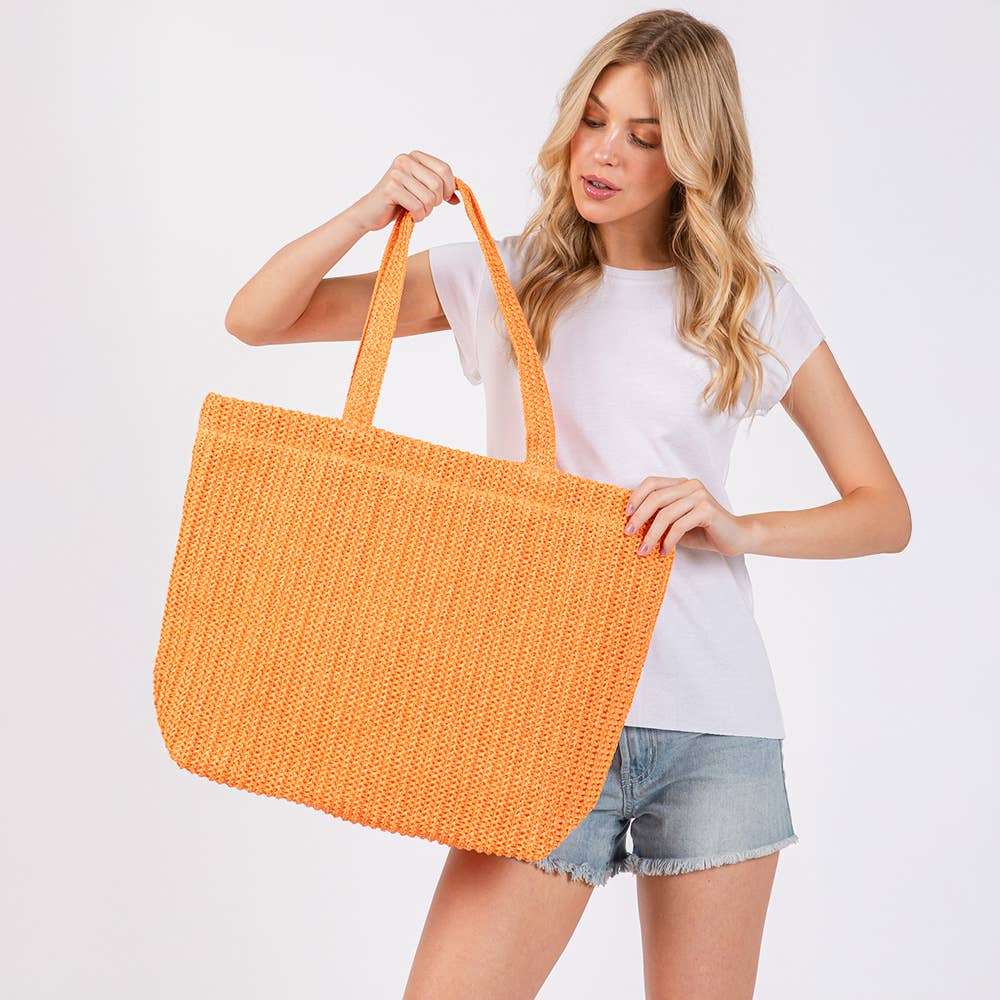 Solid crochet straw tote bag, private label beach handbag with woven design and sturdy handles for summer outings.