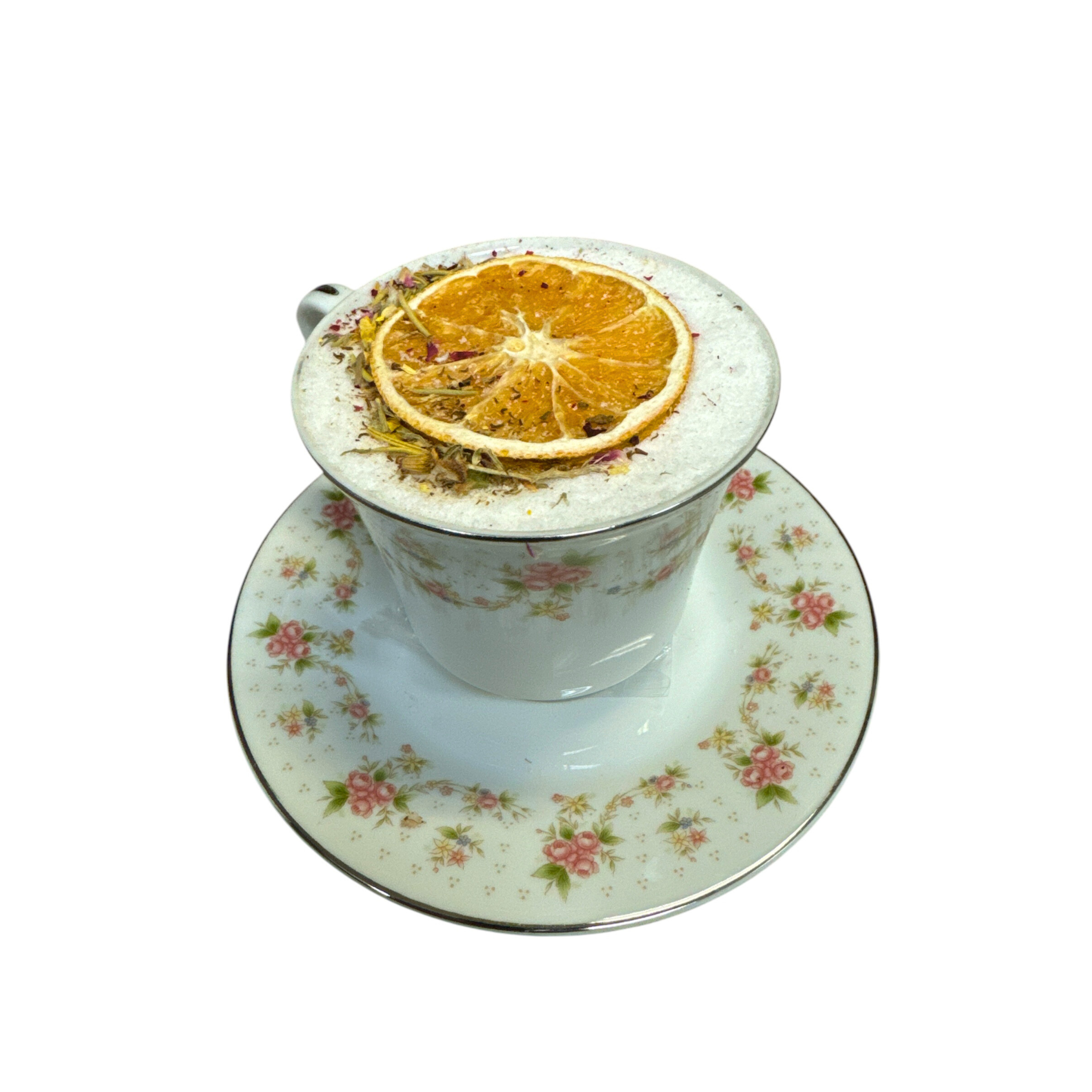 Antique tea cup bath bombs in pastel colors, featuring floral designs, set against a soft, neutral background.