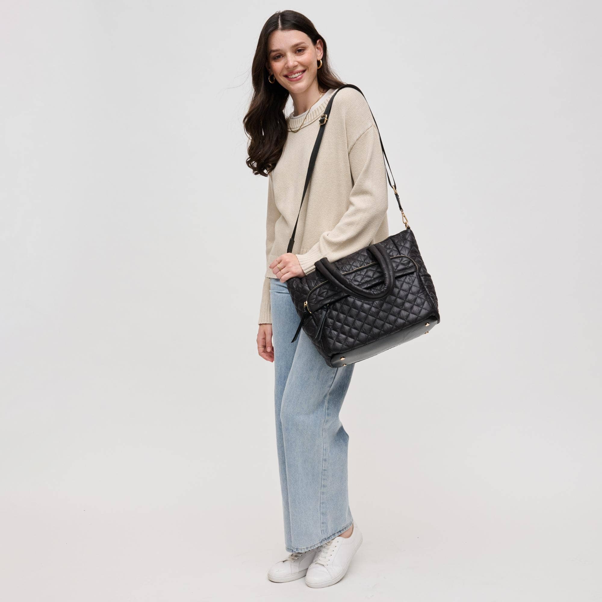 Urban Expressions Jayna Quilted Nylon Tote in a stylish quilted design with sturdy handles and spacious interior.