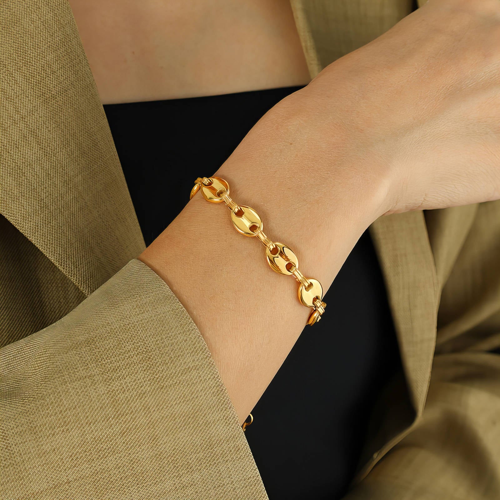 18K gold plated steel link bit bracelet showcasing a sleek design and polished finish.