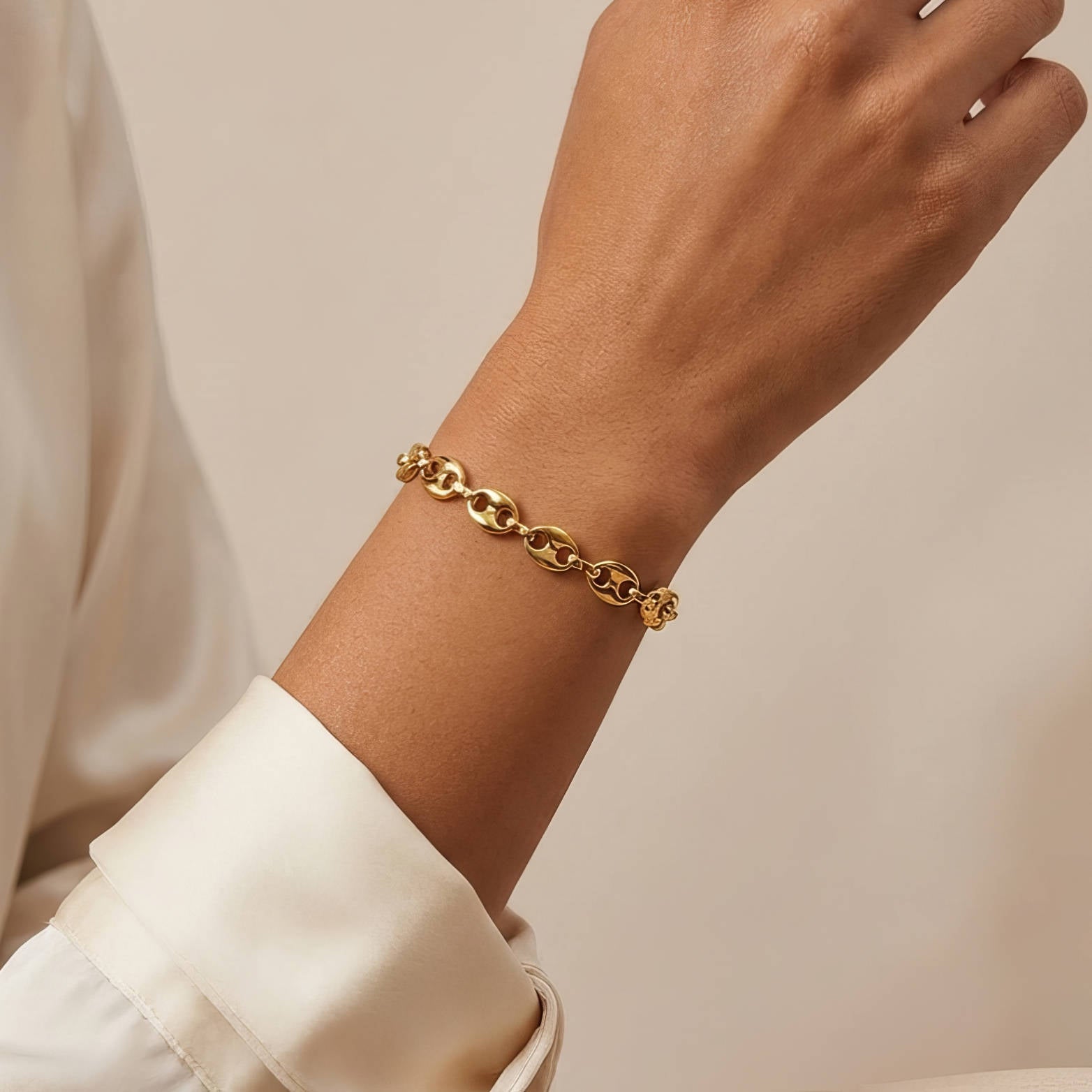 18K gold plated steel Link Bit Bracelet with interlocking links and a sleek design, perfect for everyday wear.