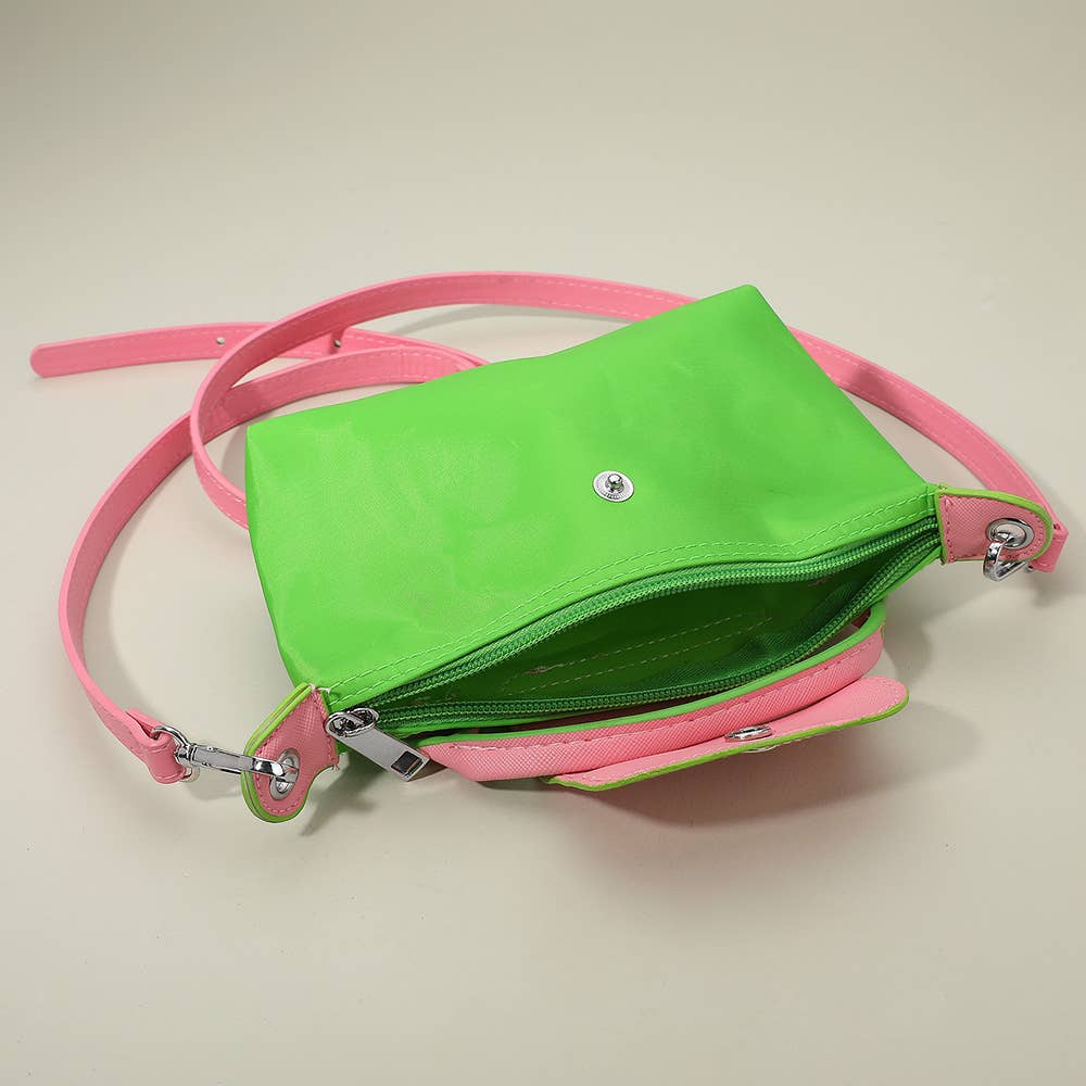 Private label compact two-tone handbag with crossbody strap, stylish accessory in black and beige tones.