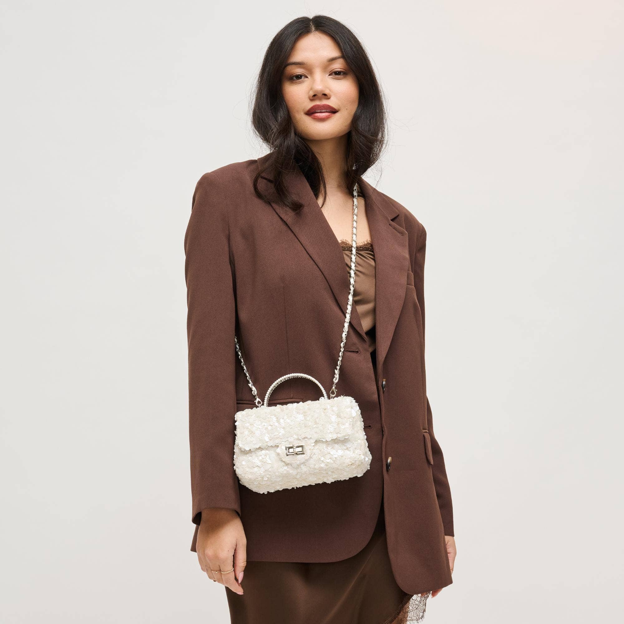 Urban Expressions Ella Evening Bag featuring sleek design, metallic accents, and elegant structure for stylish evening occasions.