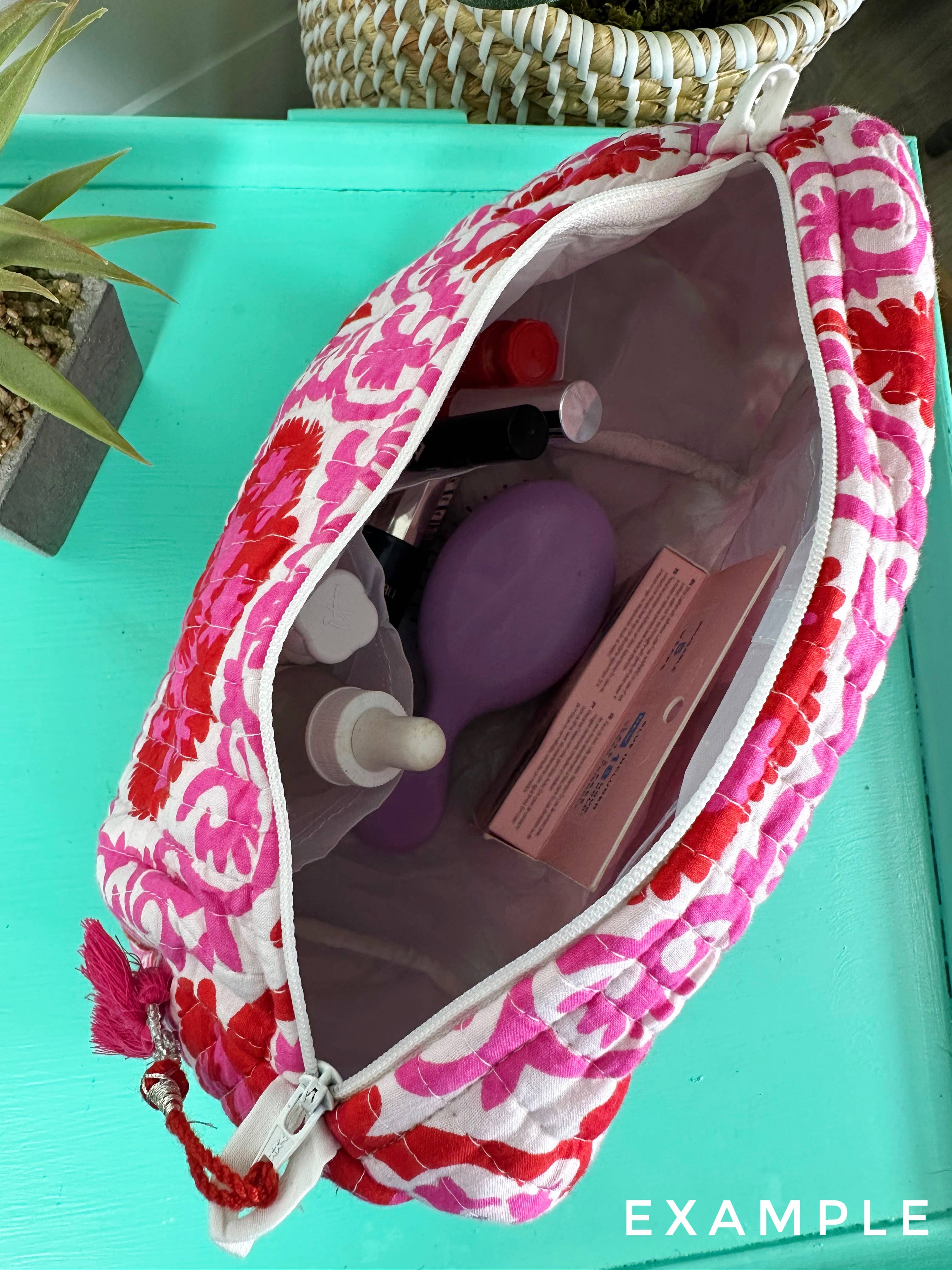Quilted strawberry makeup bag by Folklore Couture, featuring a stylish design ideal for travel cosmetics and pouches.