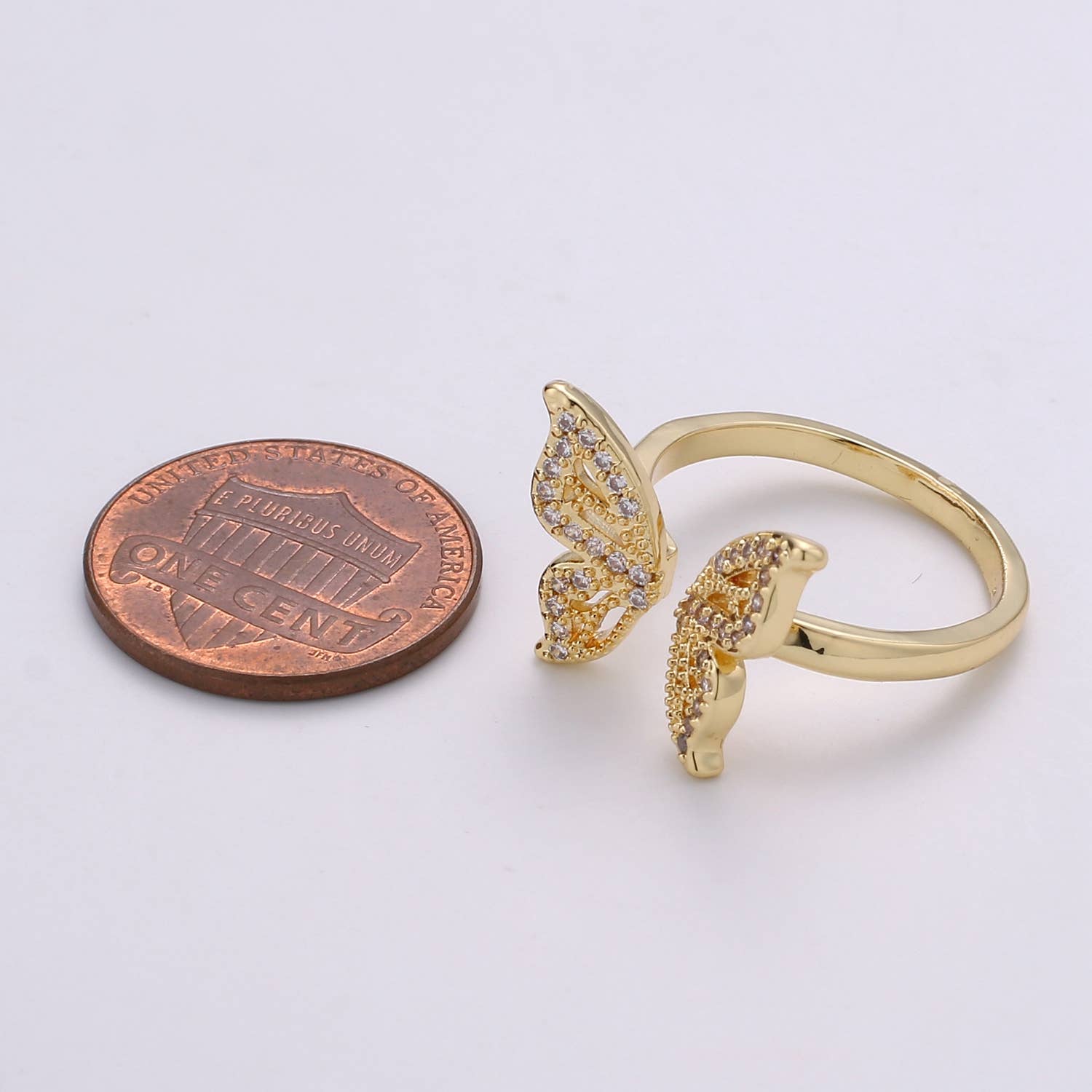 Sterling silver CZ open butterfly ring with detailed butterfly design, featuring sparkling cubic zirconia stones.