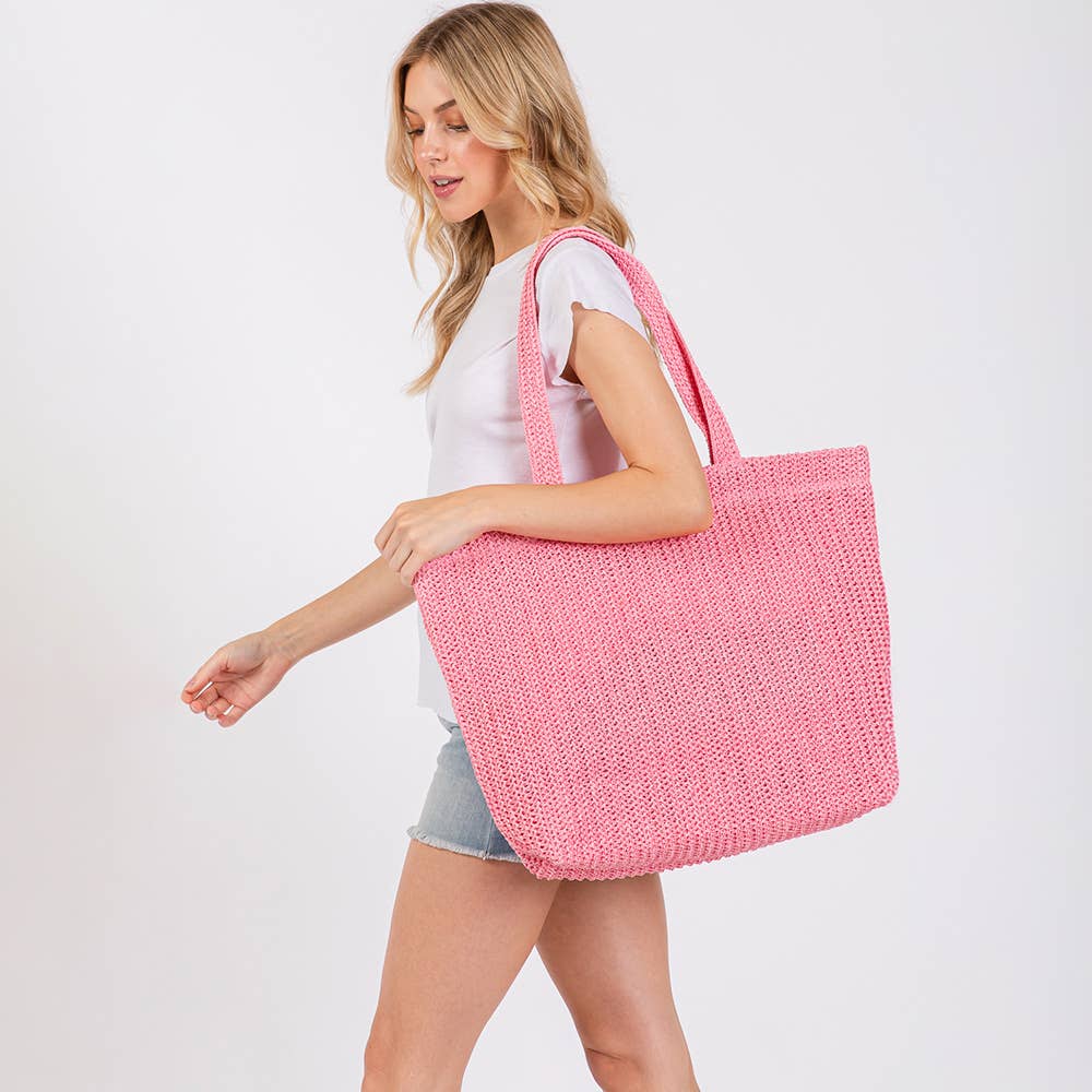 Solid crochet straw tote bag, private label beach handbag with sturdy handles and woven design for casual summer or beach trips.